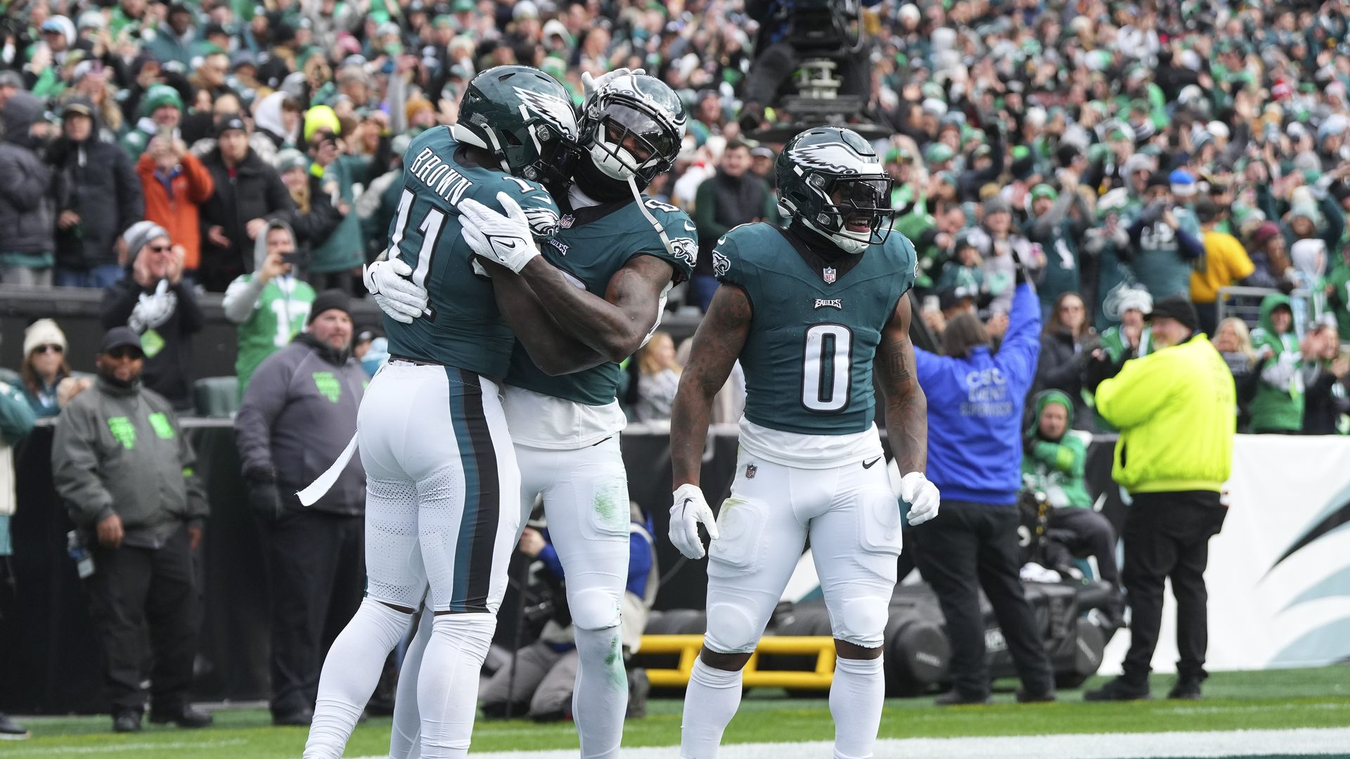 Eagles wide receiver A.J. Brown gets a hug from teammate Julio Jones.