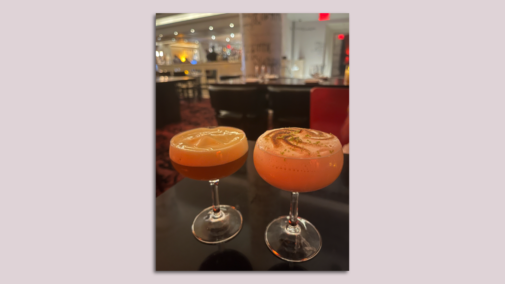 Two cocktails from The Bazaar are pictured on a table. 