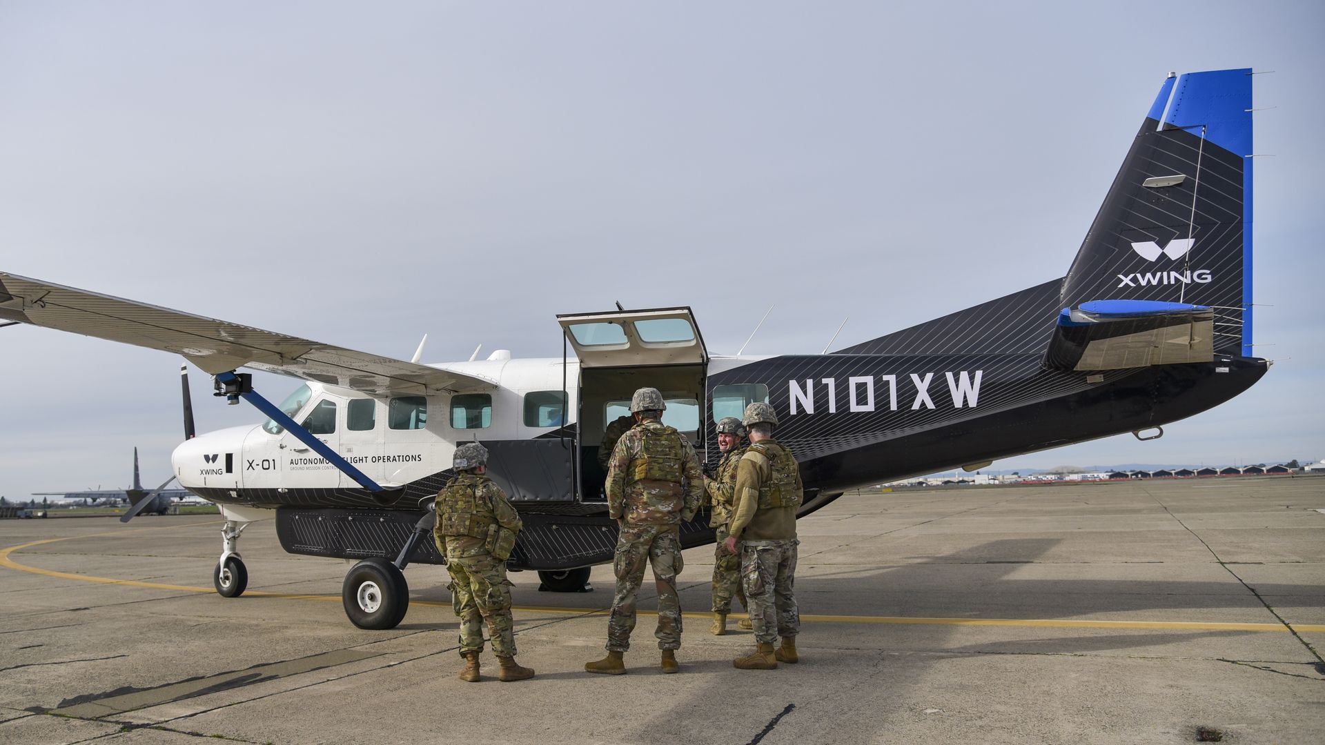 Airmen load cargo into Xwing's autonomous aircraft, a Cessna 208B Grand Caravan, during AGILE FLAG 24-1 at McClellan Airfield in Sacramento, California, Jan. 27, 2024. 