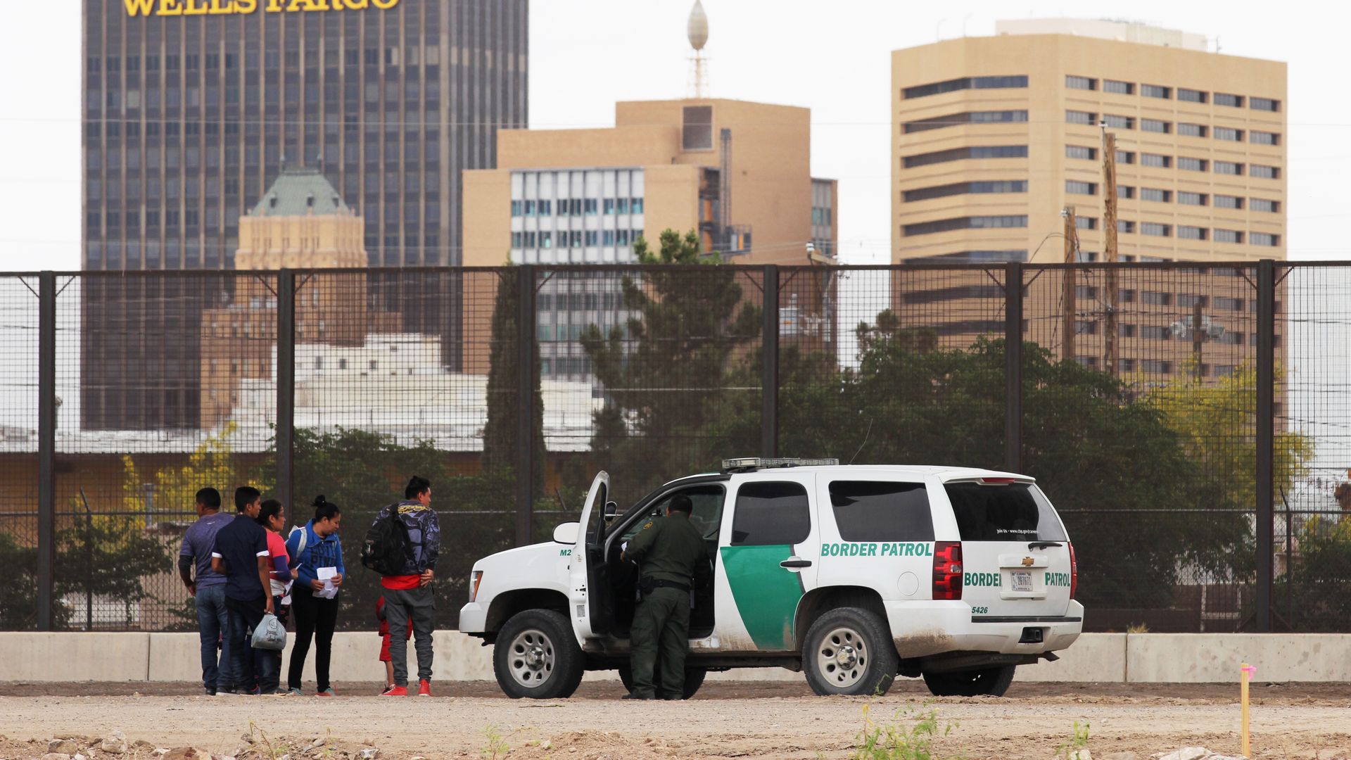 Central American migrants detained by U.S. Customs and Border Patrol agents on the border between El Paso, Texas