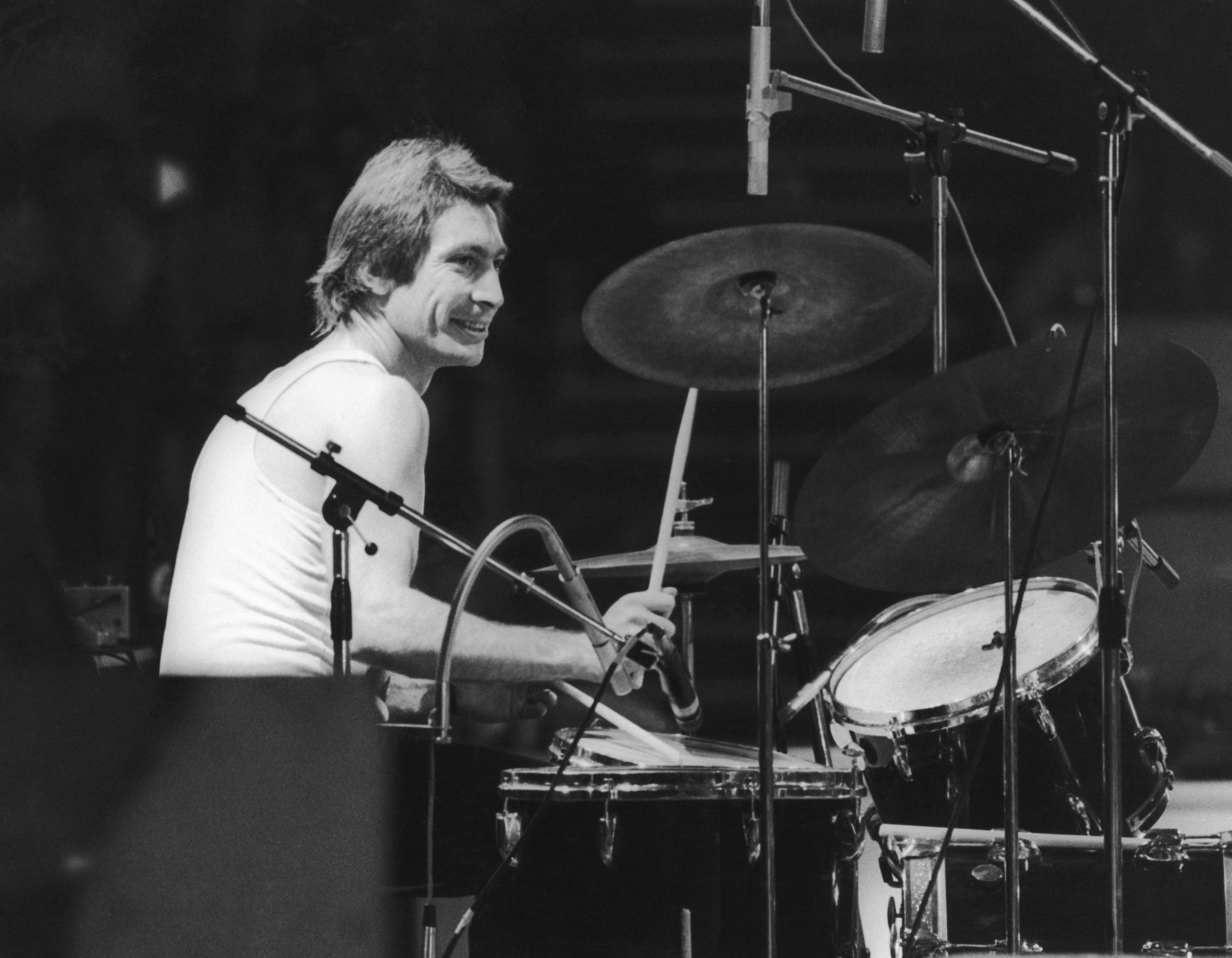 Drummer Charlie Watts of the Rolling Stones, at a British concert and sporting a new David Bowie style feather cut in 1973.