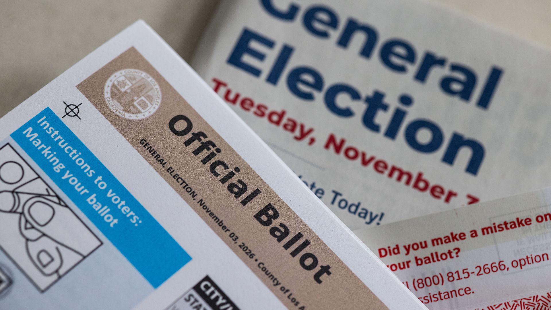 In this photo illustration, a detail of an official vote by mail ballot and return envelope, as well as a general election official voter information guide, mailed to a Southern California resident ahead of the general election, photographed on October 17, 2026 in Los Angeles, California.