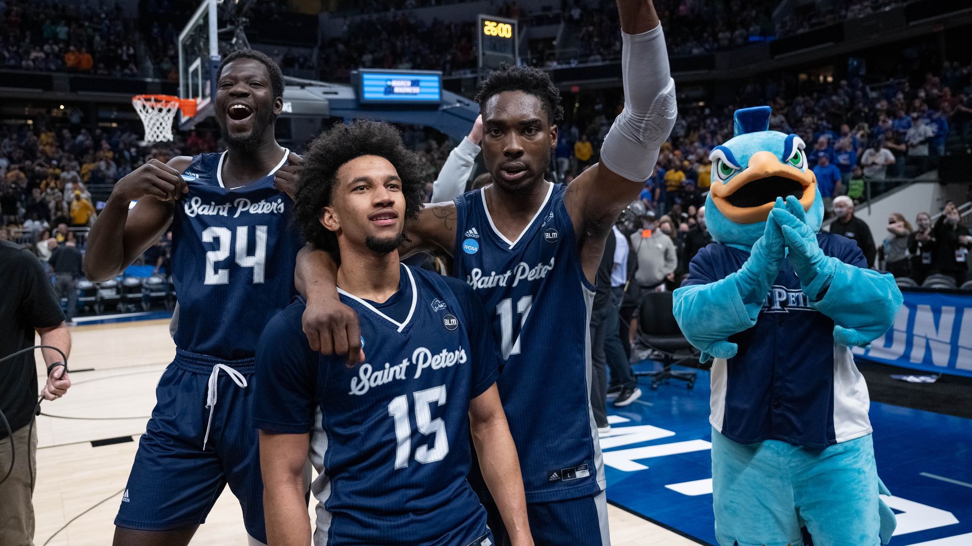 Saint Peter's players celebrating their victory over Kentucky on March 17.