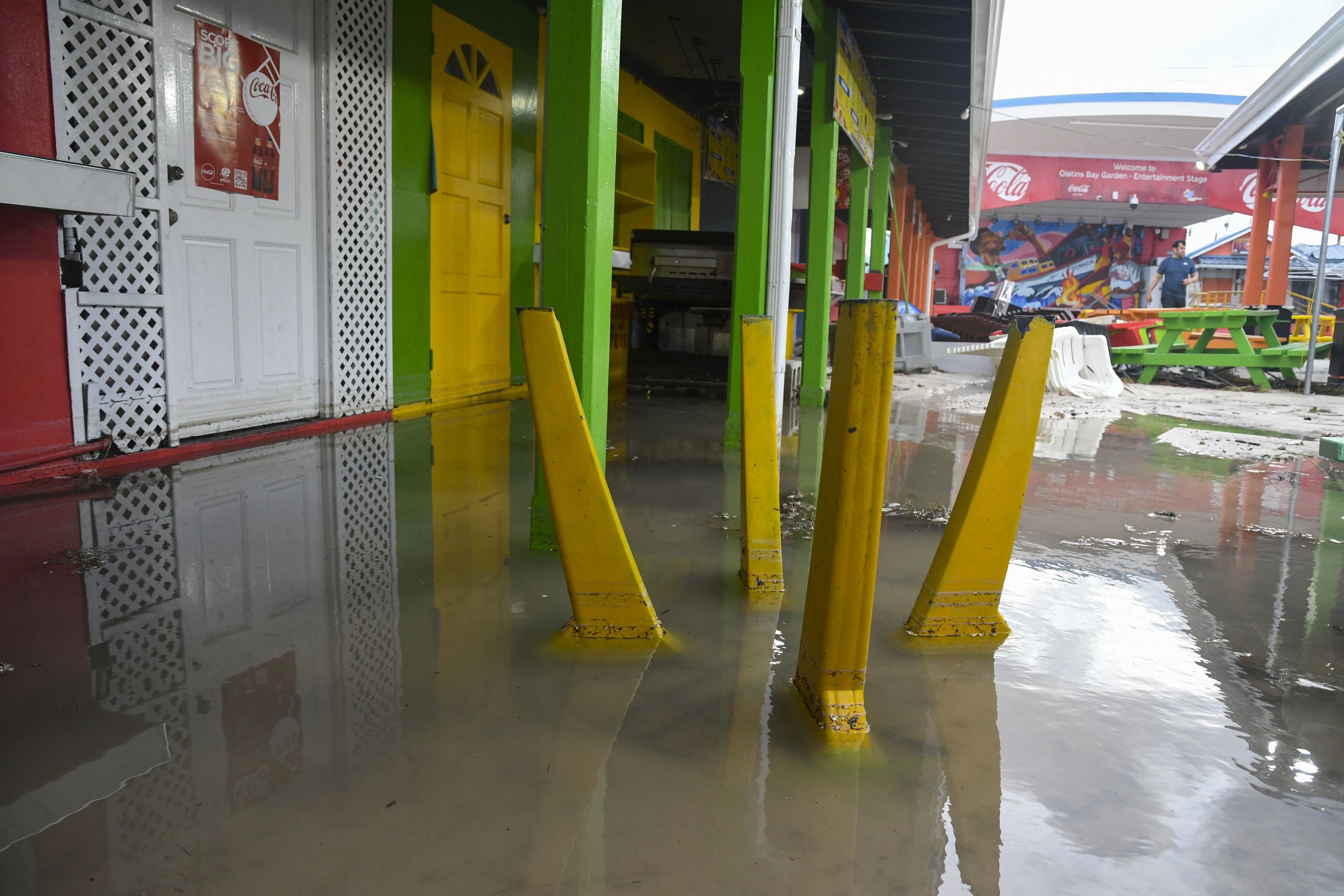 Damaged outdoor furniture is seen in a flooded area after the passage of Hurricane Beryl in Oistins gardens, Christ Church, Barbados on July 1, 2024