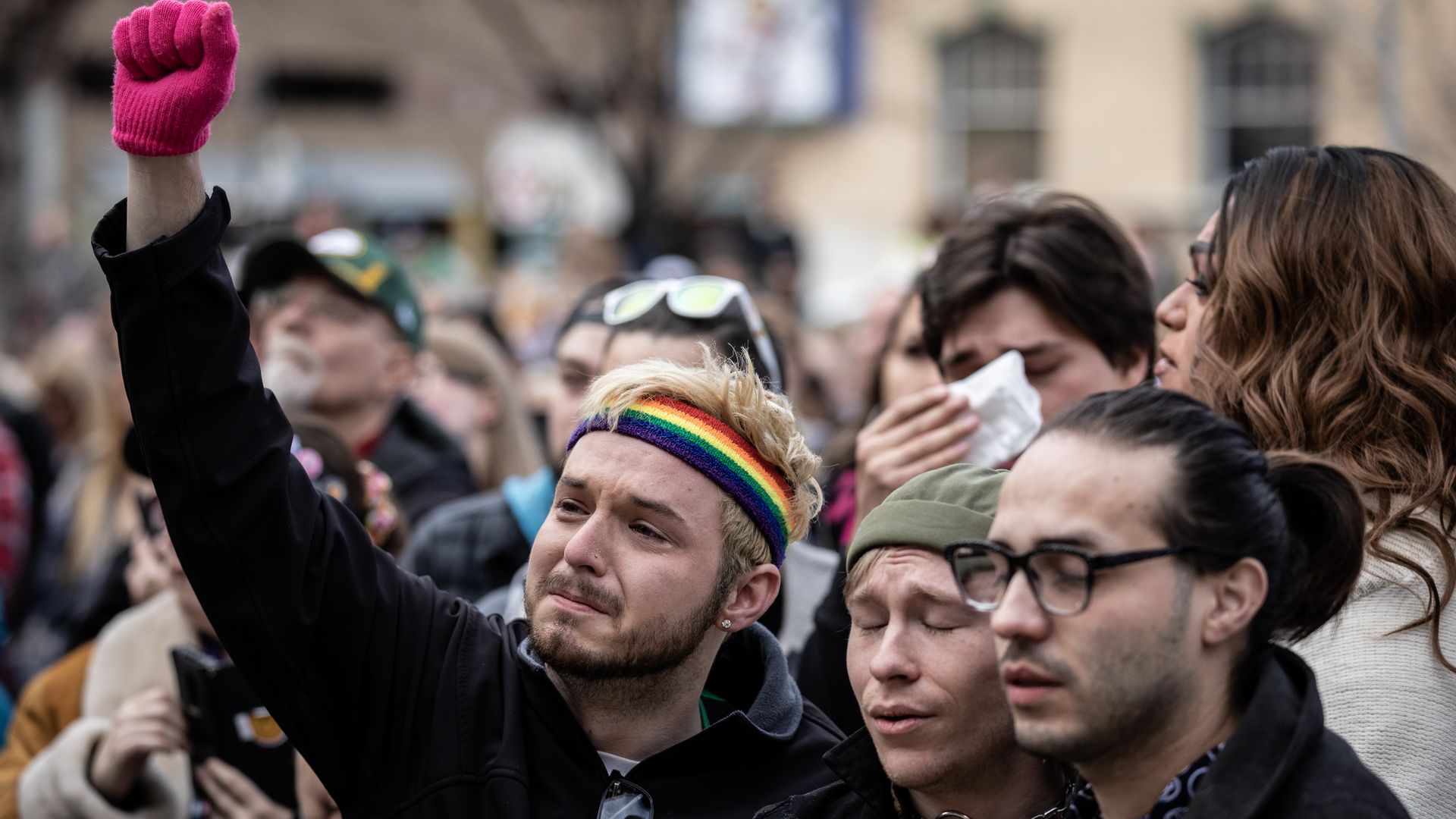 Mourners outside of the Colorado Springs City Hall where a rainbow flag was draped Nov. 23 to honor of the victims of a shooting at Club Q. Photo: Chet Strange/Getty Images