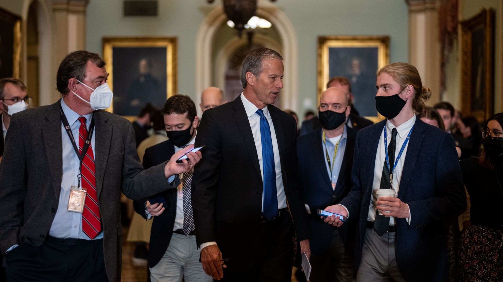 Reporters are seen gathering around Sen. John Thune - the minority whip - ahead of the Republican Party's weekly lunch on Tuesday.