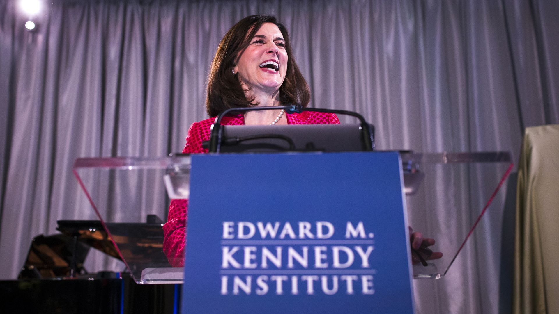 Vicki Kennedy is shown laughing.
