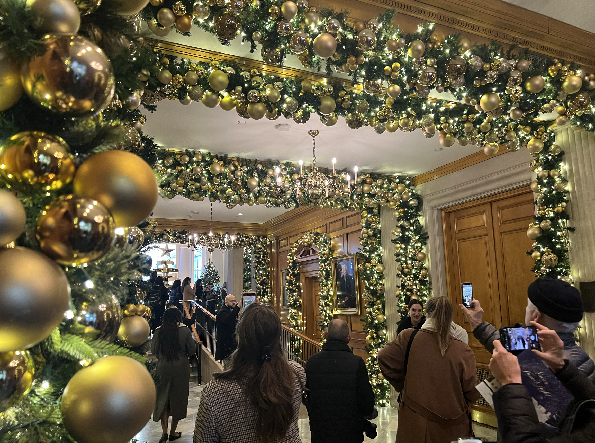 The East Wing lobby decorated with garlands and gold ornaments.