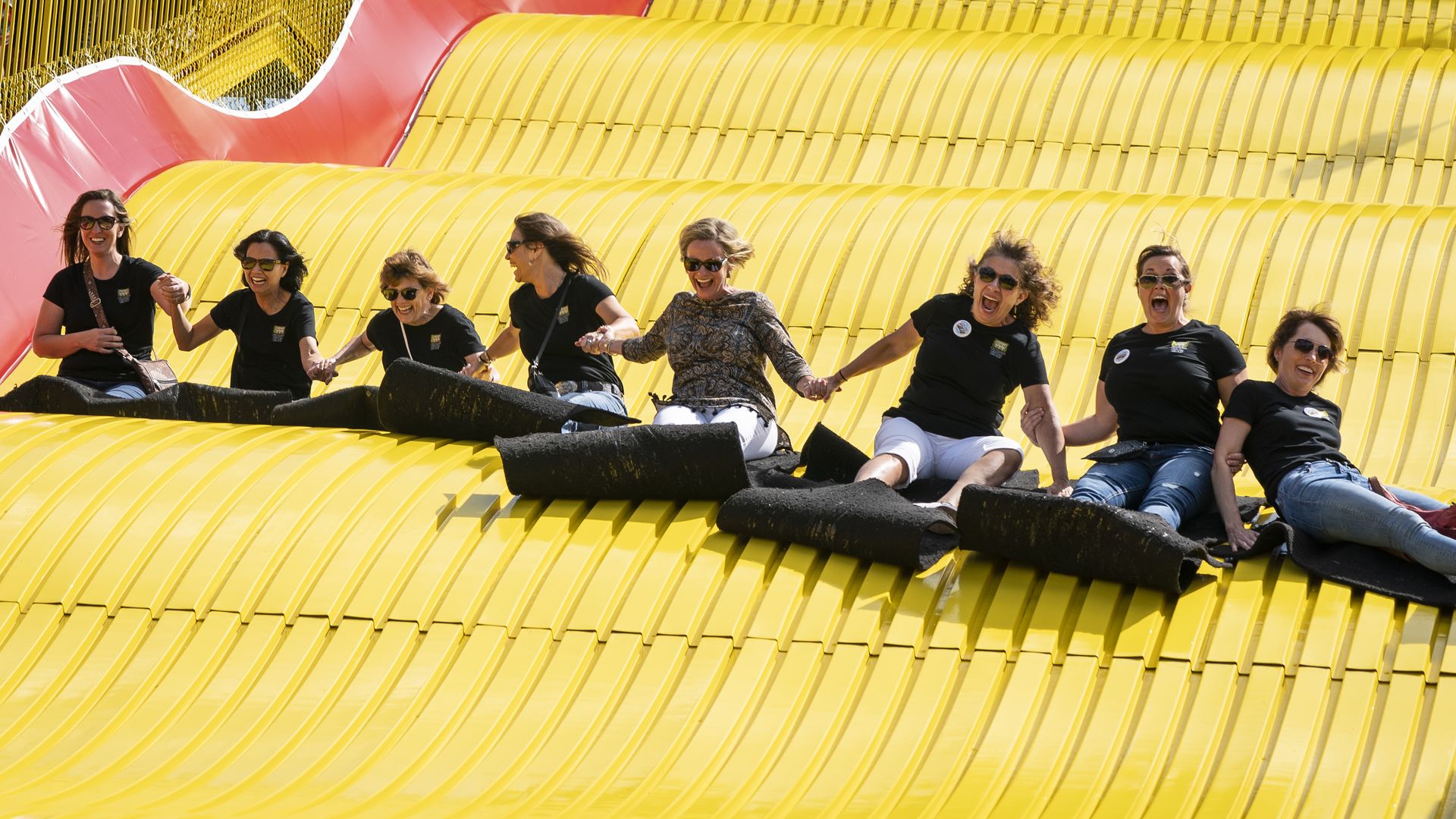 A group of ladies ride the Giant Slide together at the Minnesota State Fair 
