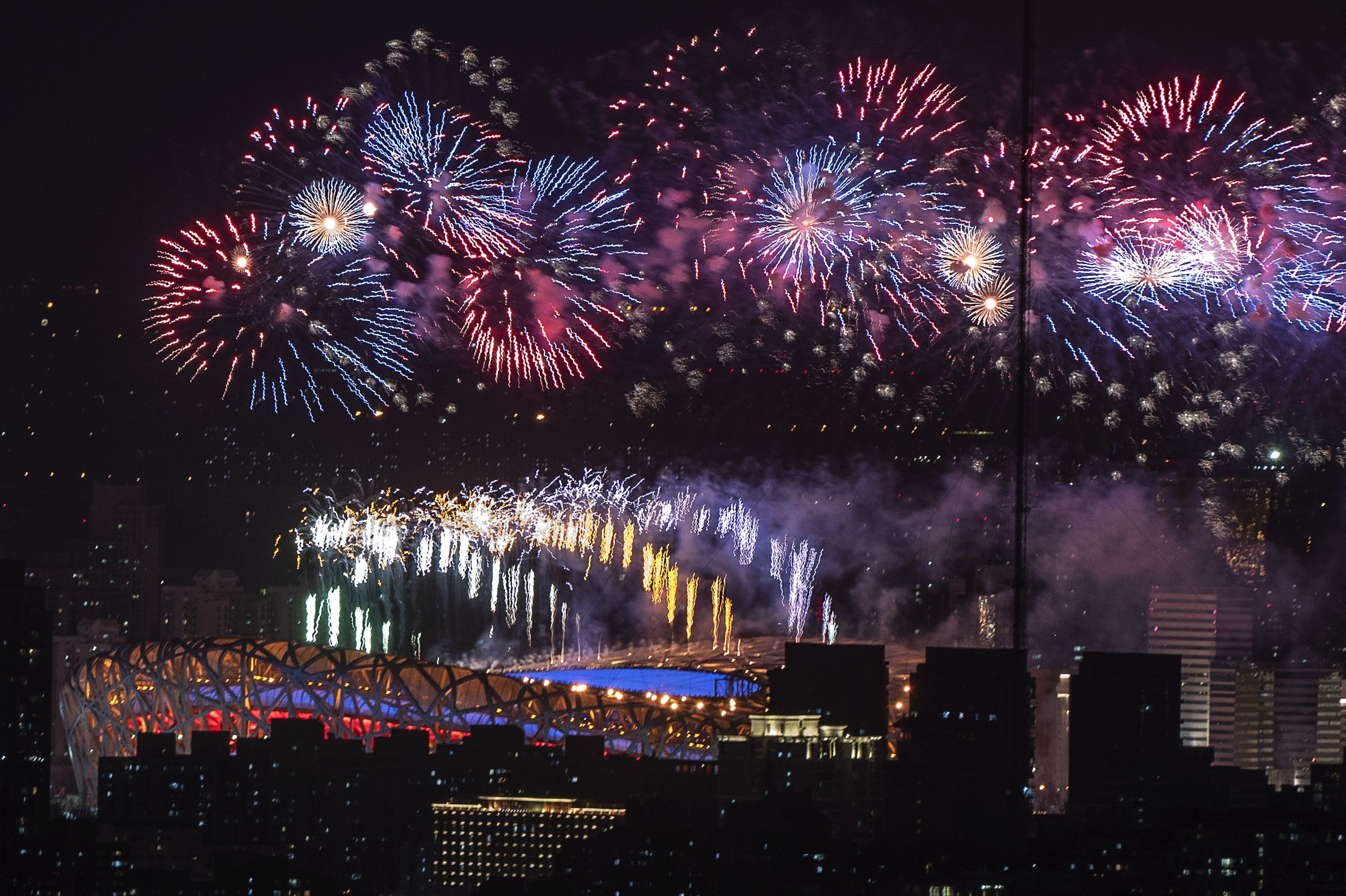 Fireworks explode over the Beijing National Stadium
