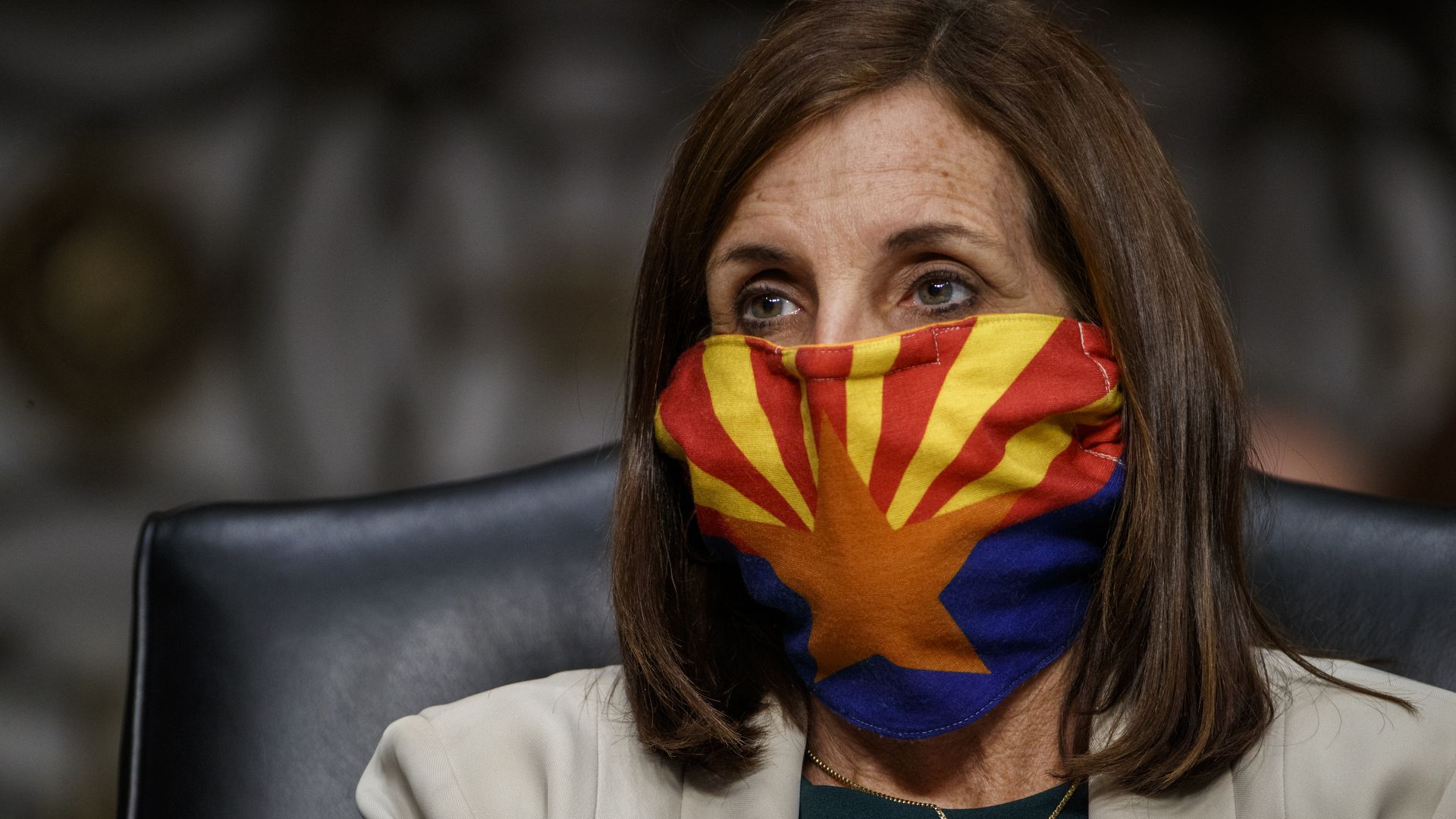 Martha McSally wears a colorful orange and yellow bandana 