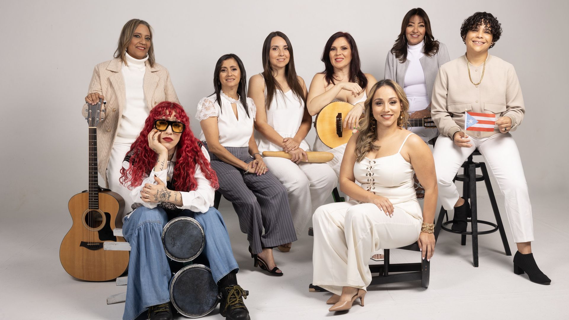 Members of the all-women trova group, Versos de Mujer, pose for a photo ahead of the BoriCorridor Tour in Boston