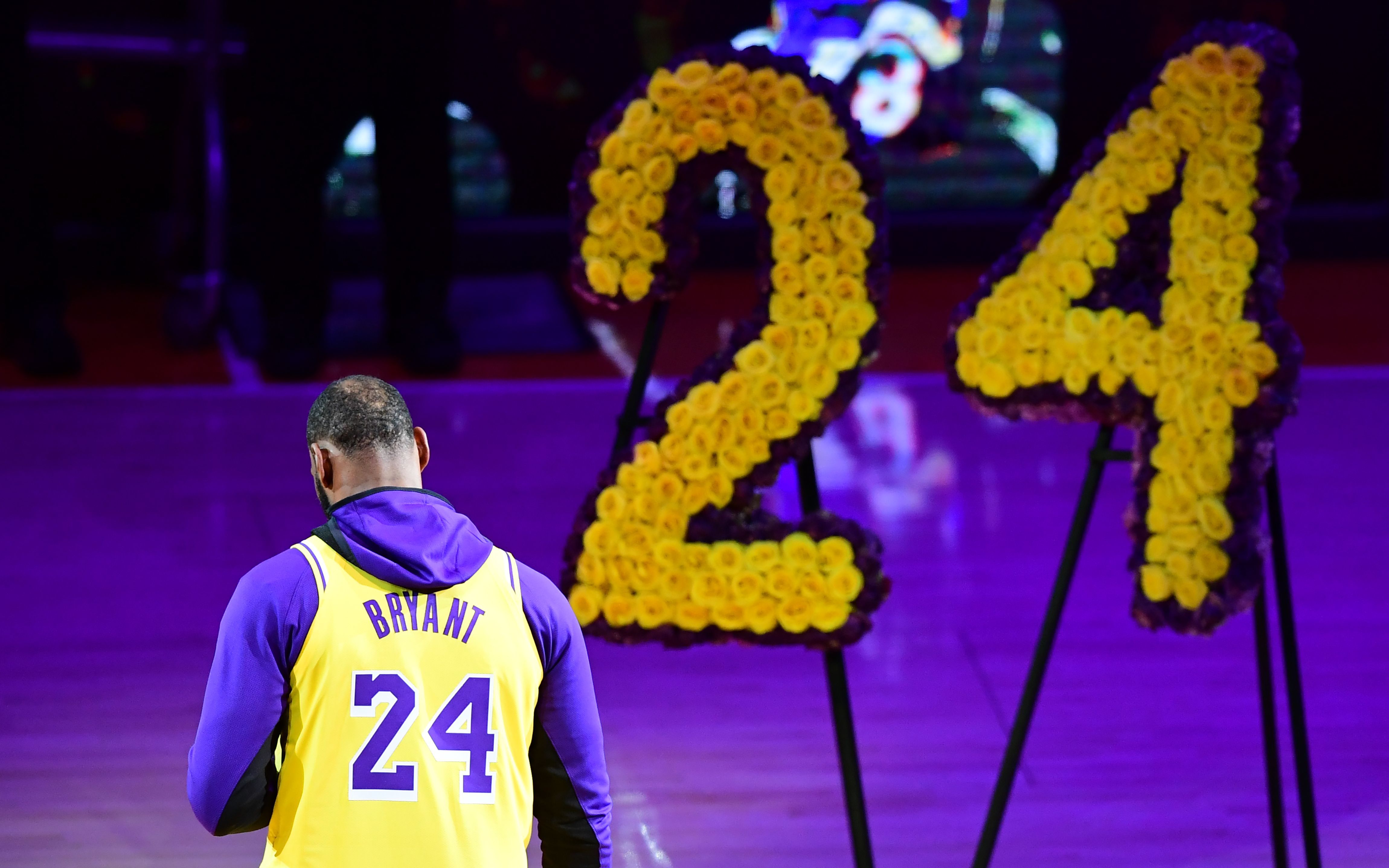 In this image, yellow roses spell out "24" to honor Bryant's jersey letter