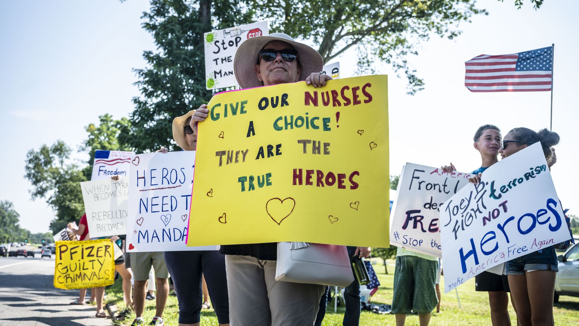 Health care workers protest against being forced to get the Covid-19 vaccine