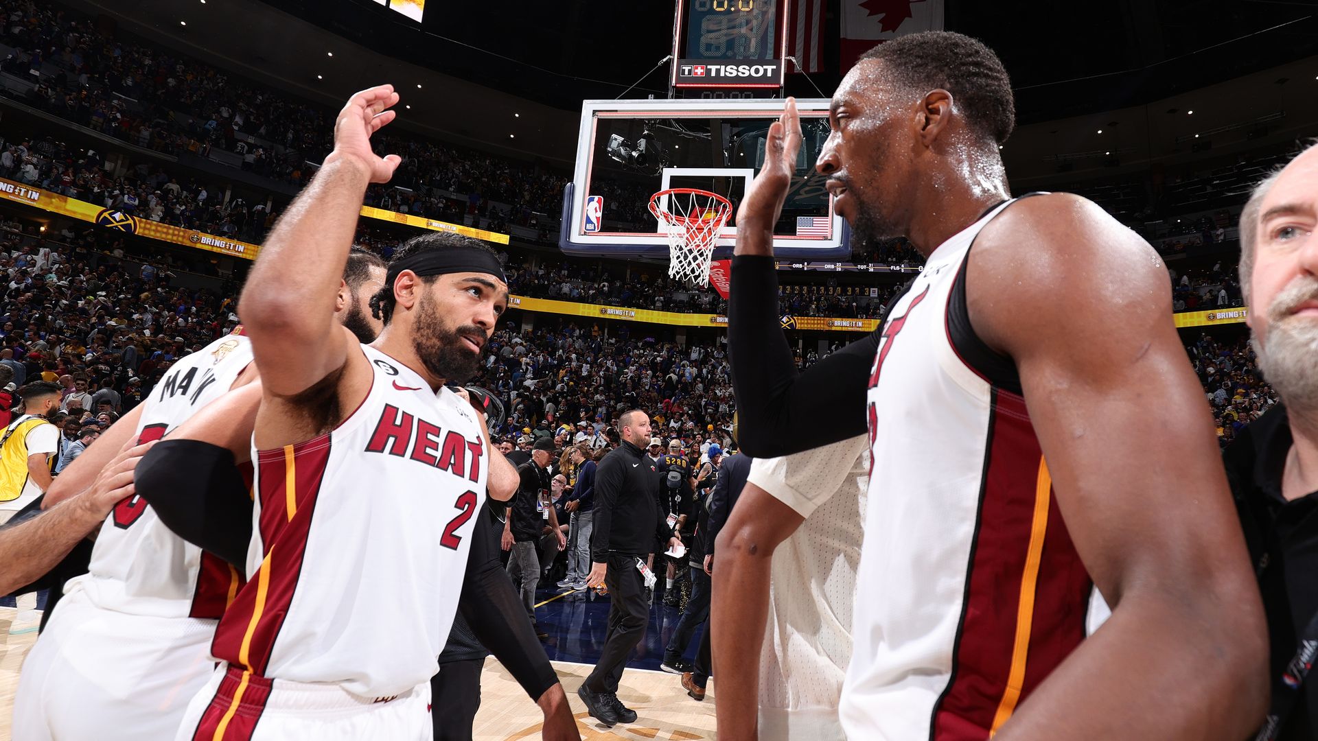 Heat players high five after Game 2 win in the NBA Finals.