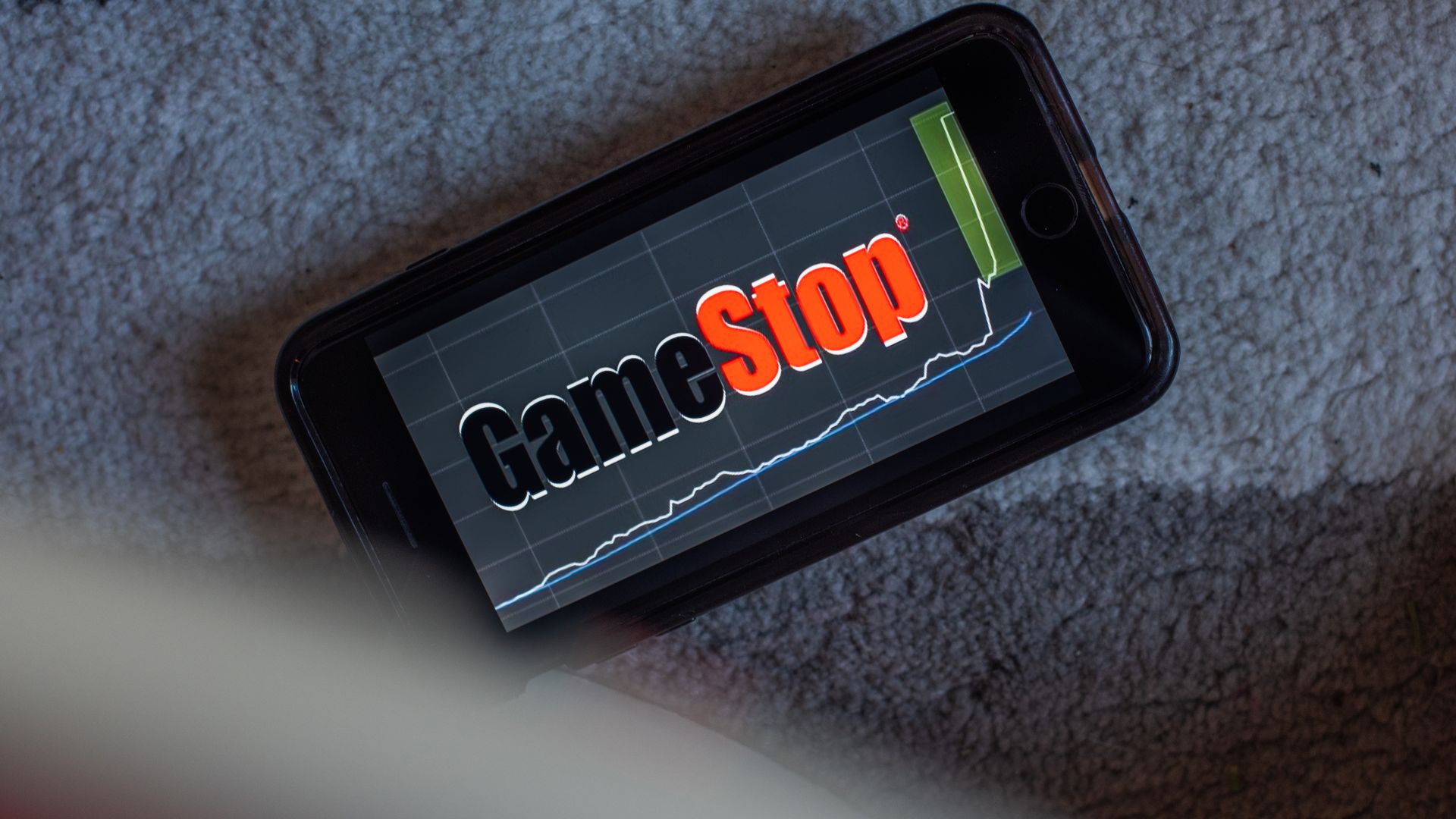 Photo of a phone that has the GameStop logo on it
