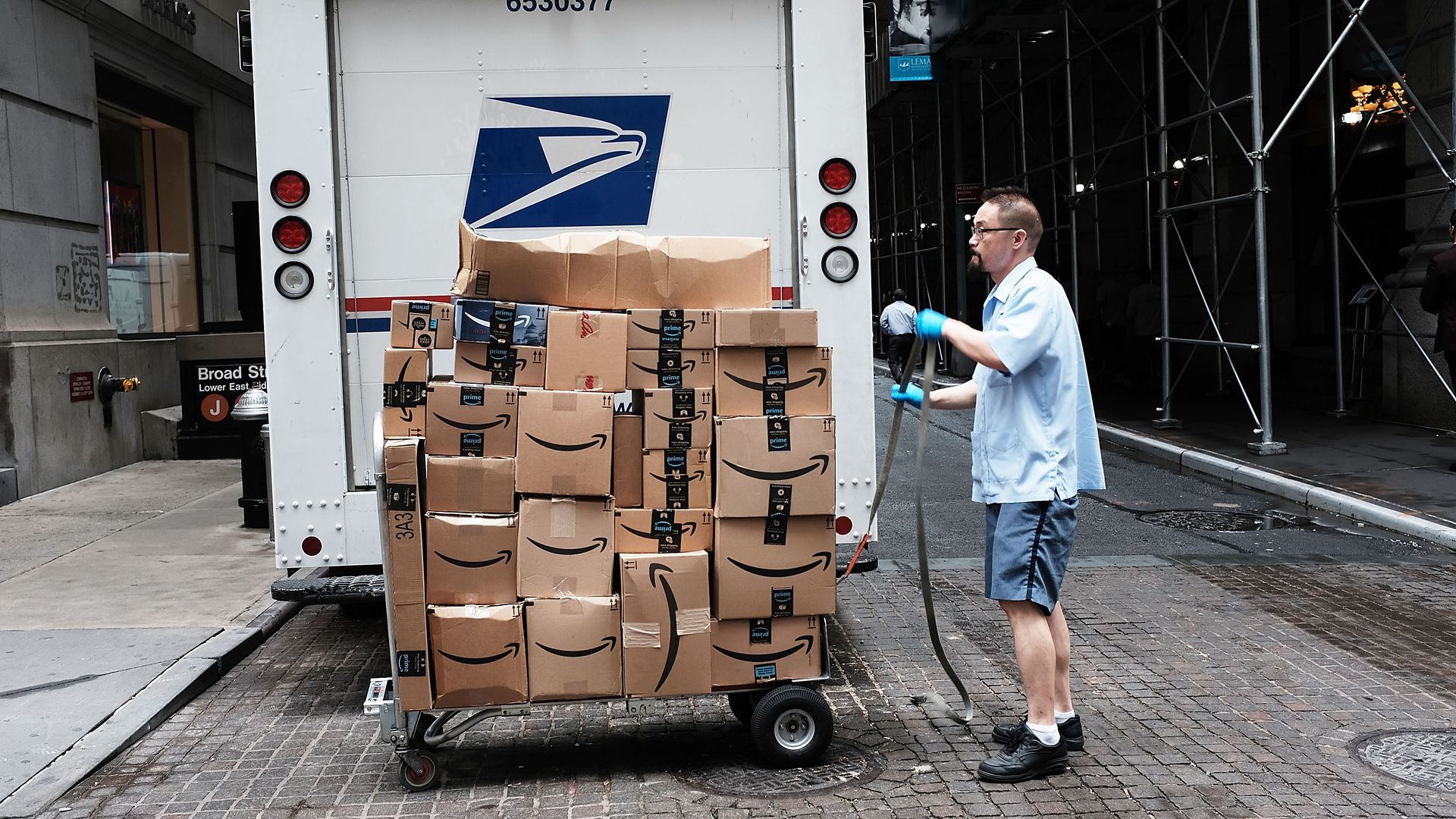 USPS truck with amazon packages