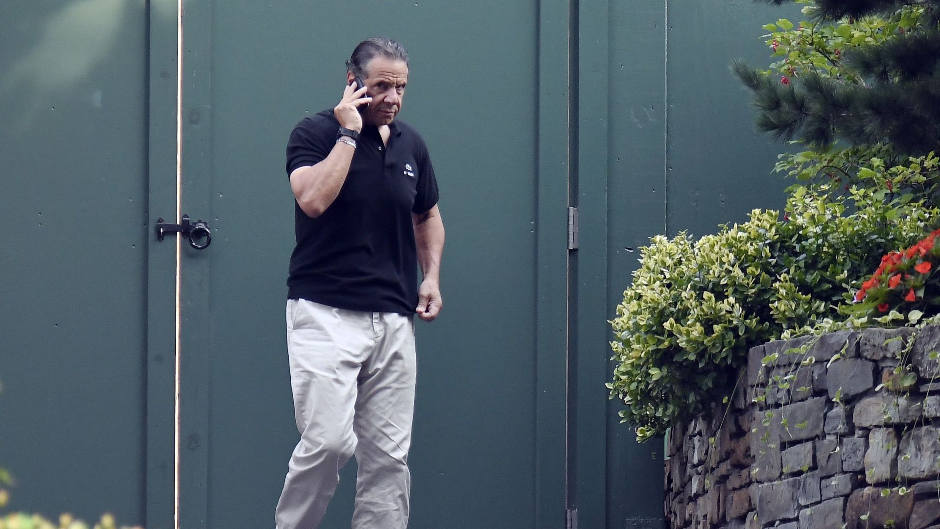 Gov. Andrew Cuomo walks his dog, Captain, at the Executive Mansion in Albany yesterday. Photo: Hans Pennink/AP