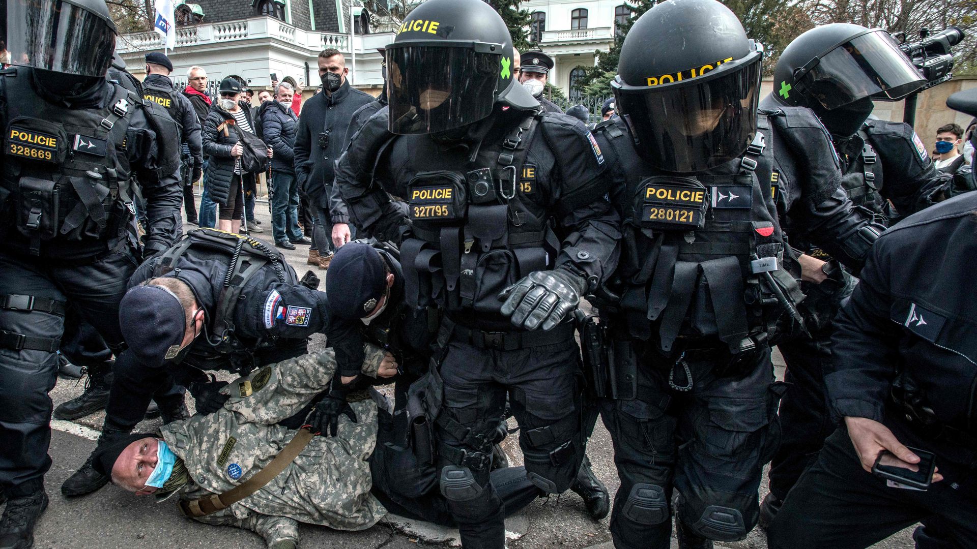 Police officers detain a pro-Russia demonstrator as protesters gather front of the Russian Embassy on April 18, 2021 in Prague