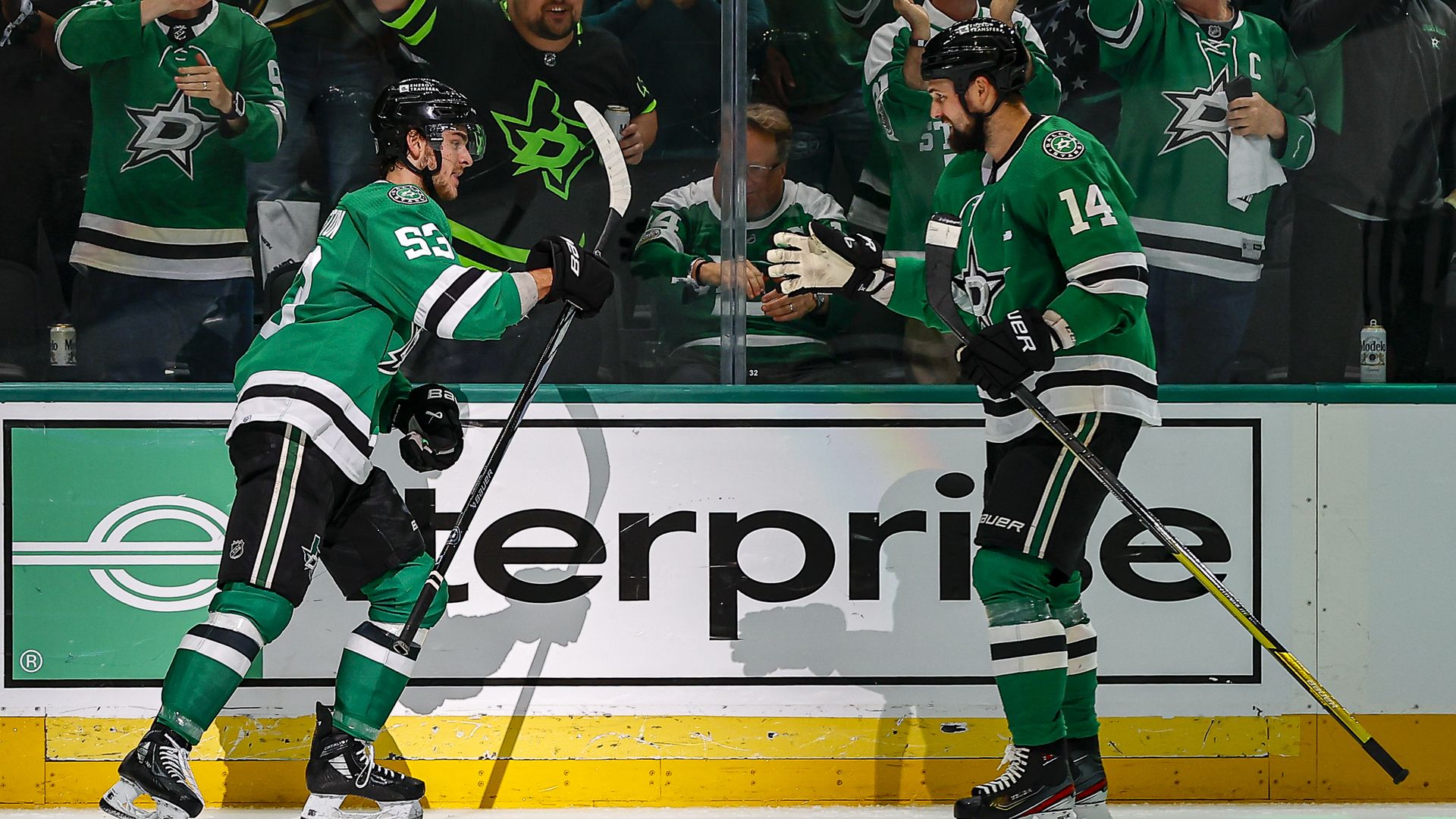 Wyatt Johnson and Jamie Benn high five during the Dallas Stars win of the first round of the Stanley Cup playoffs