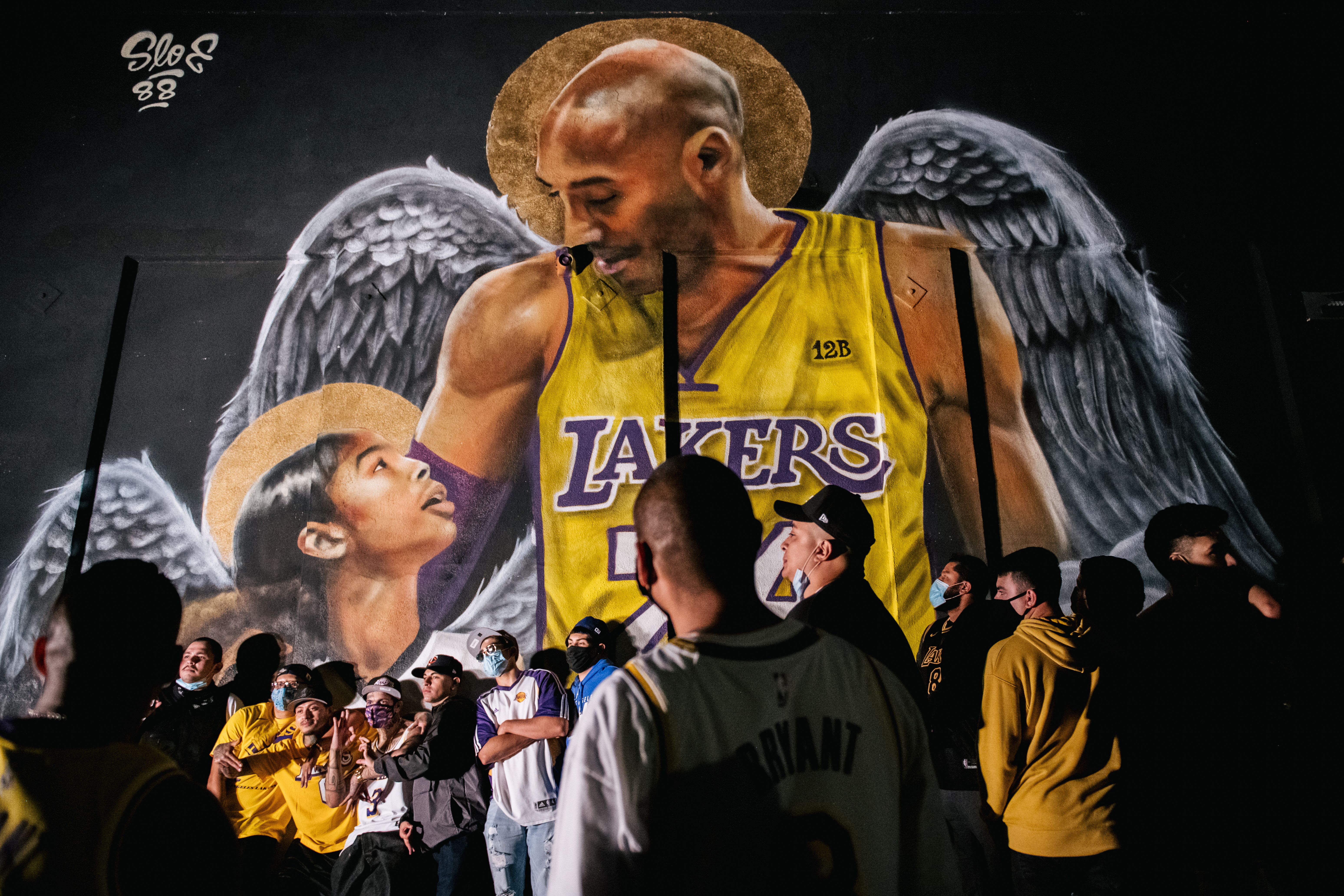Lakers fans near Kobe Bryant mural