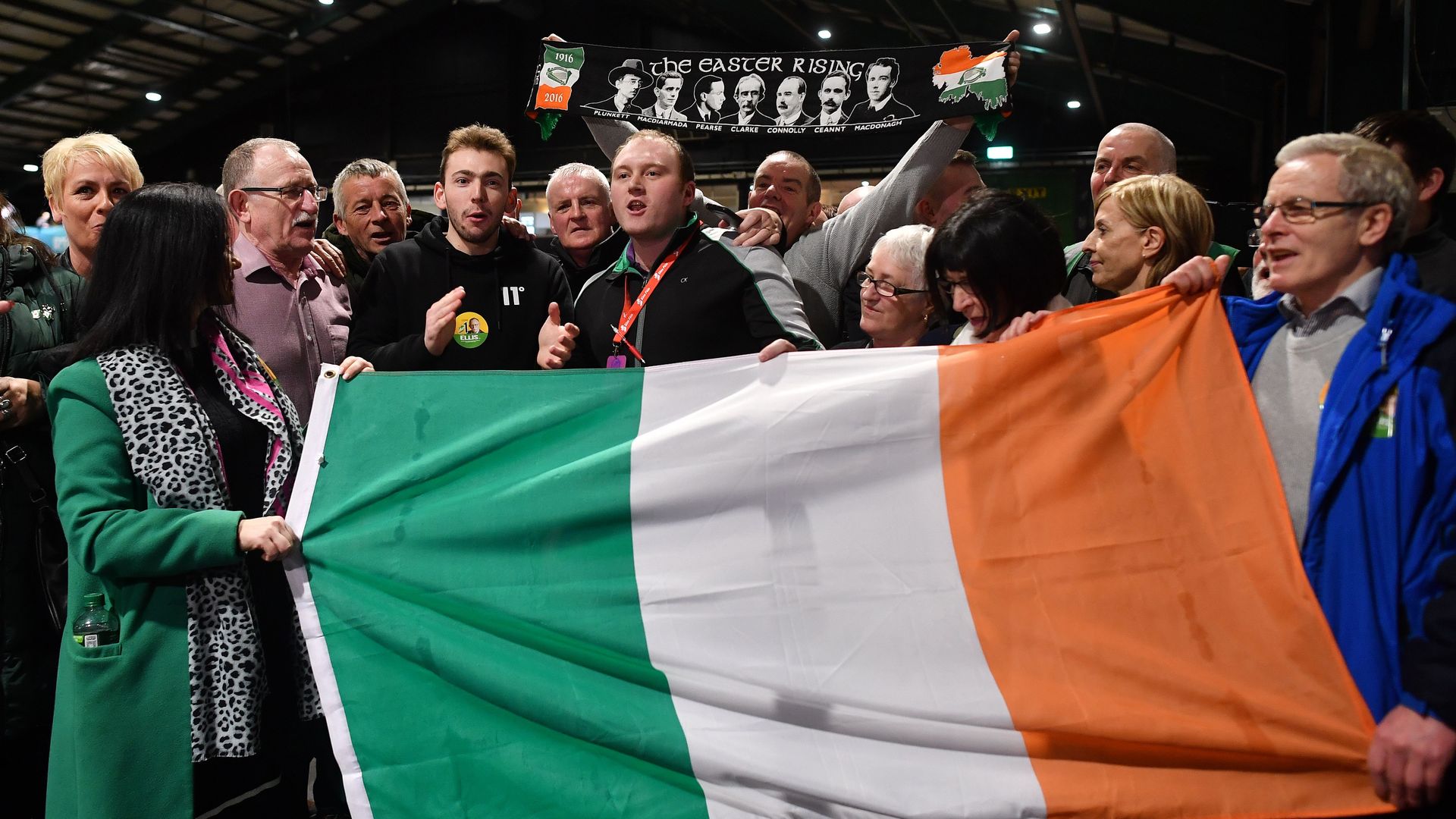 Sinn Fein party supporters hold the Irish flag in Dublin on Feb. 9, 2020