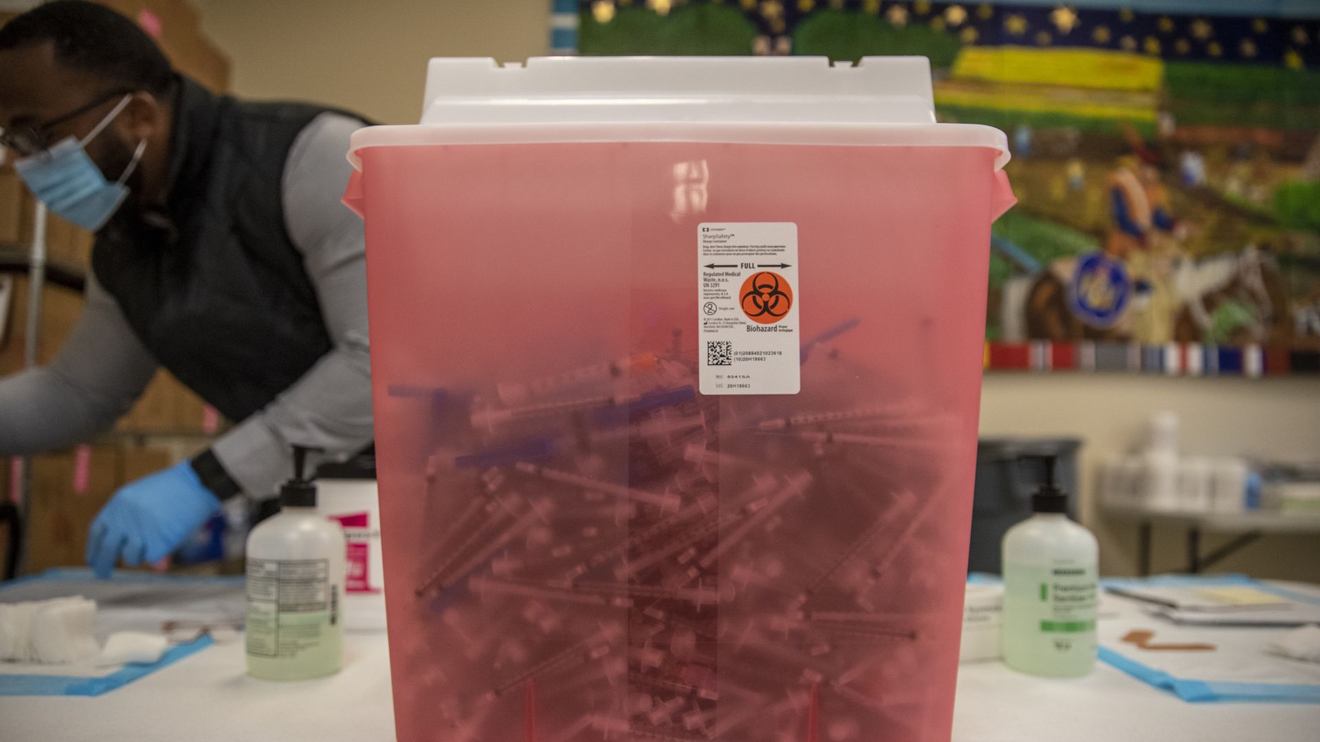 A medical wastebin filled with used syringes at a coronavirus vaccination site in San Antonio in March 2021.