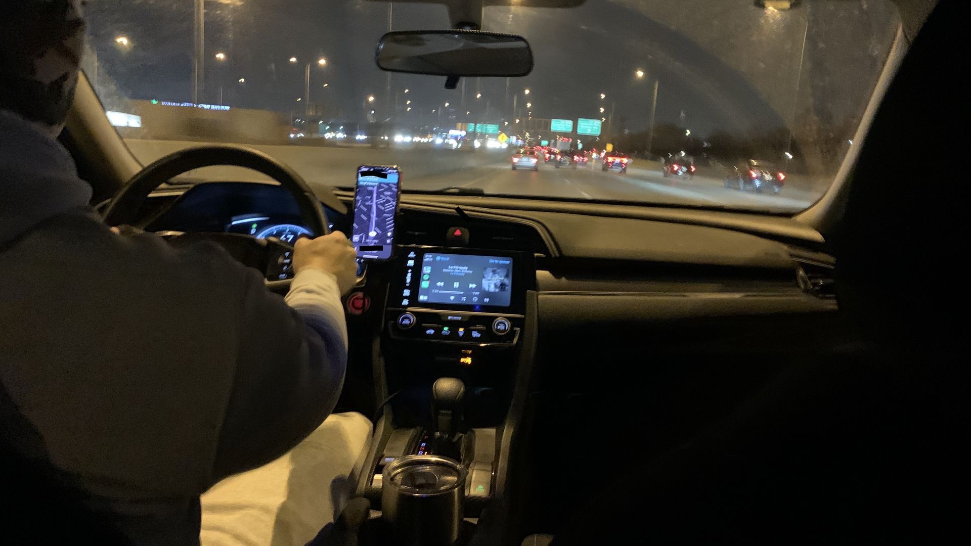 Photo of man driving a car.