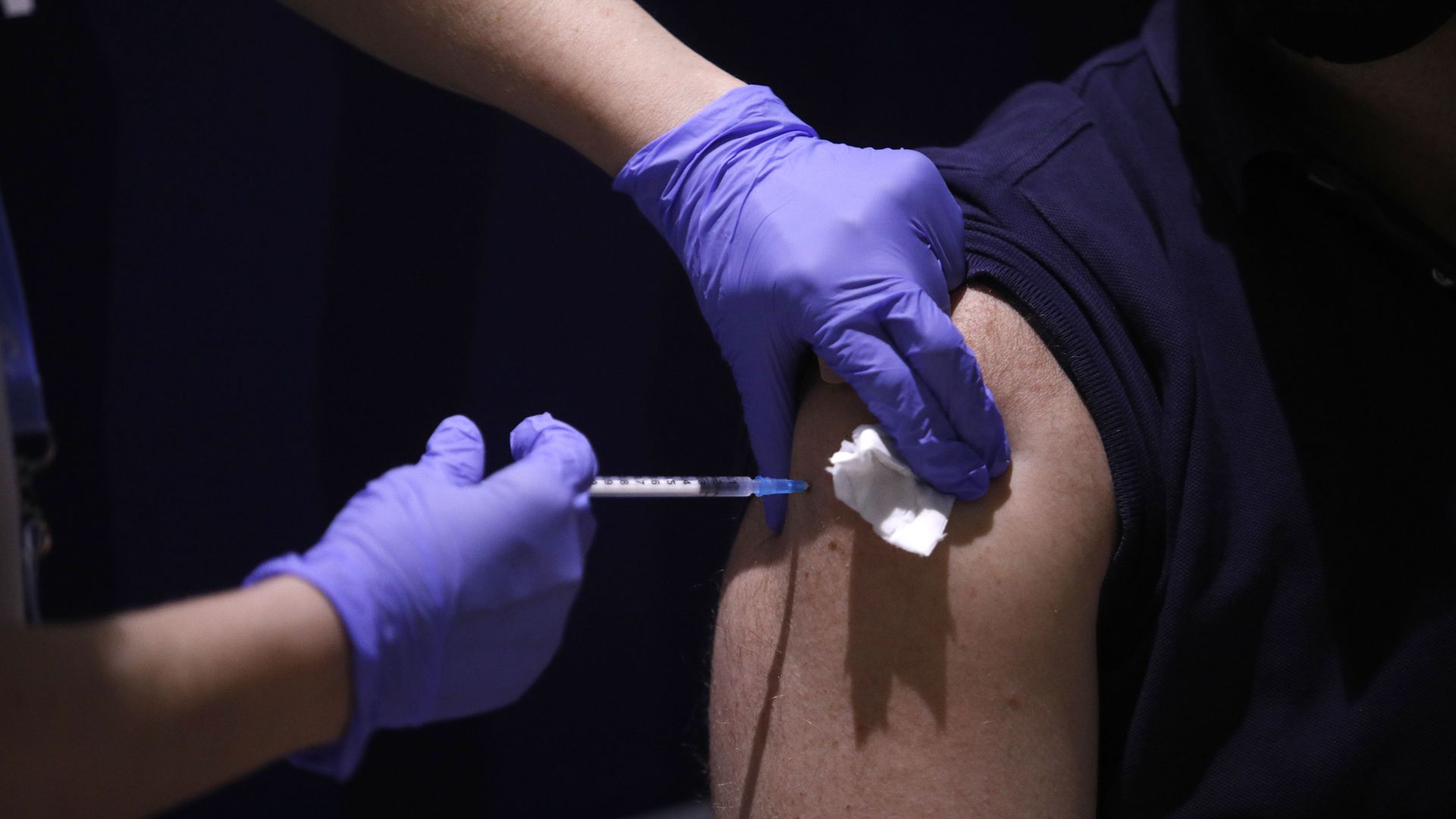 Photo of a man receiving the Pfizer covid vaccine