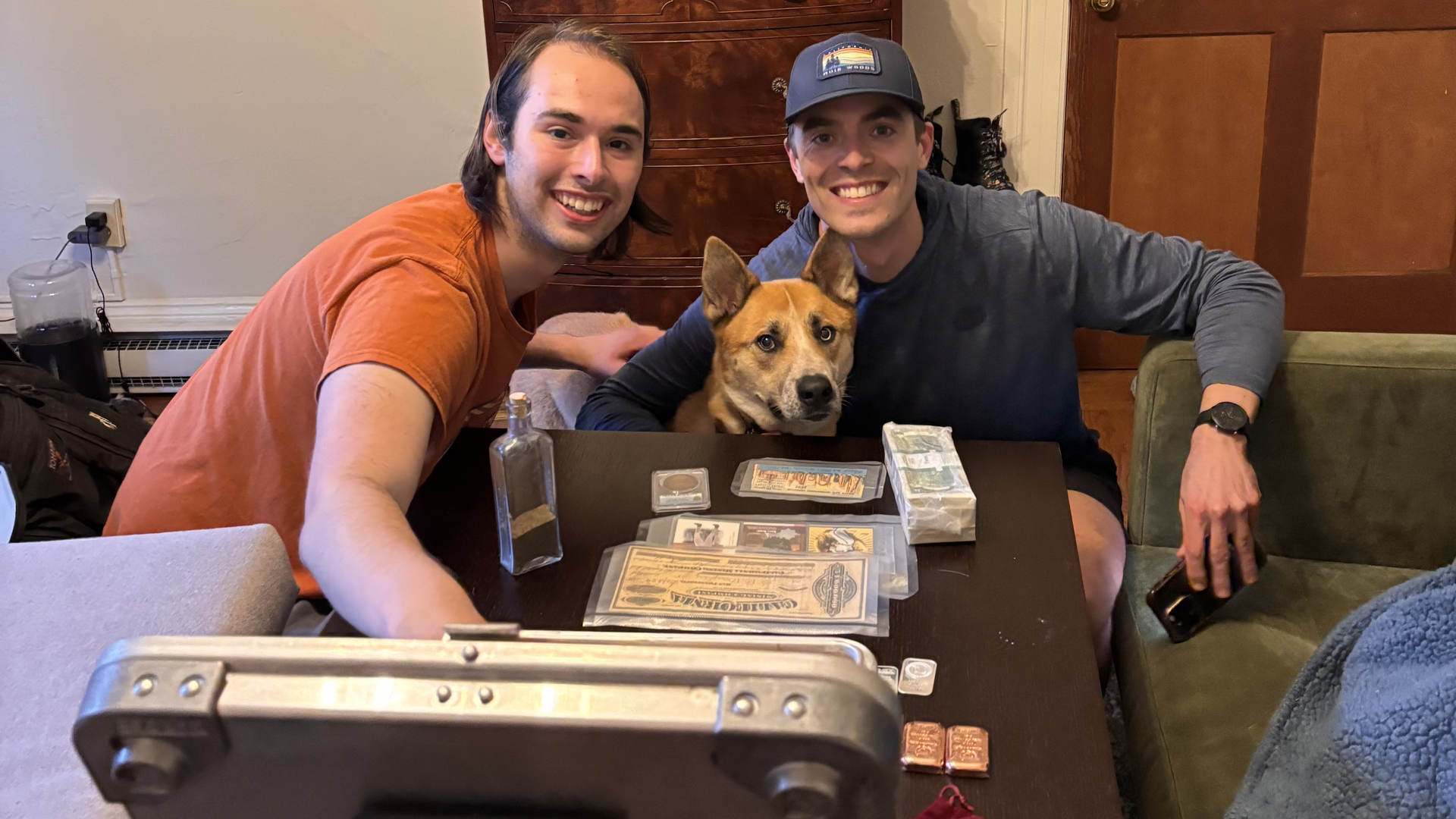 Austin Theriault (left), Erik Bahri and Franz the dog show off their haul of treasure. Photo: TJ Lee