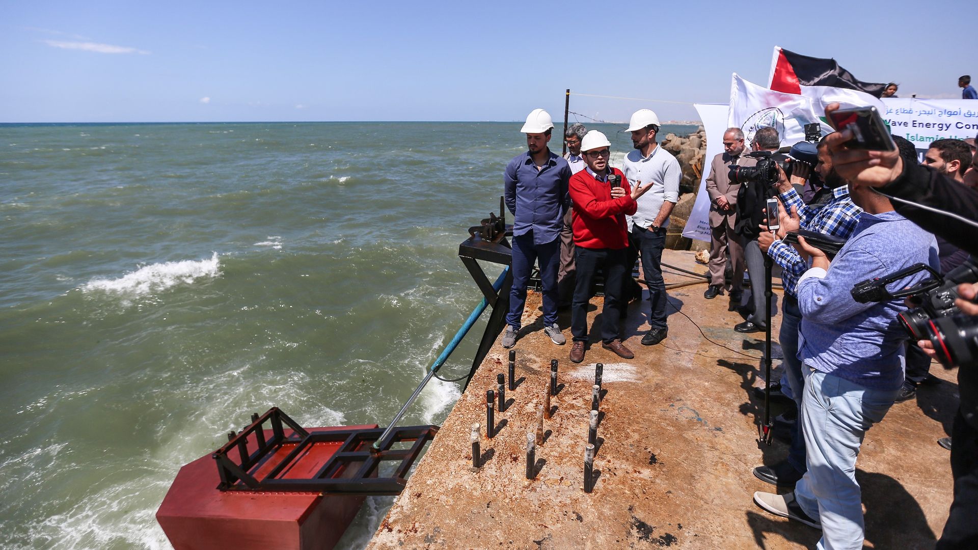 Palestinian academicians of Islamic University of Gaza attend the publicity ceremony of a tidal wave energy project at Gaza Port in Gaza City, Gaza, on April 22, 2018.