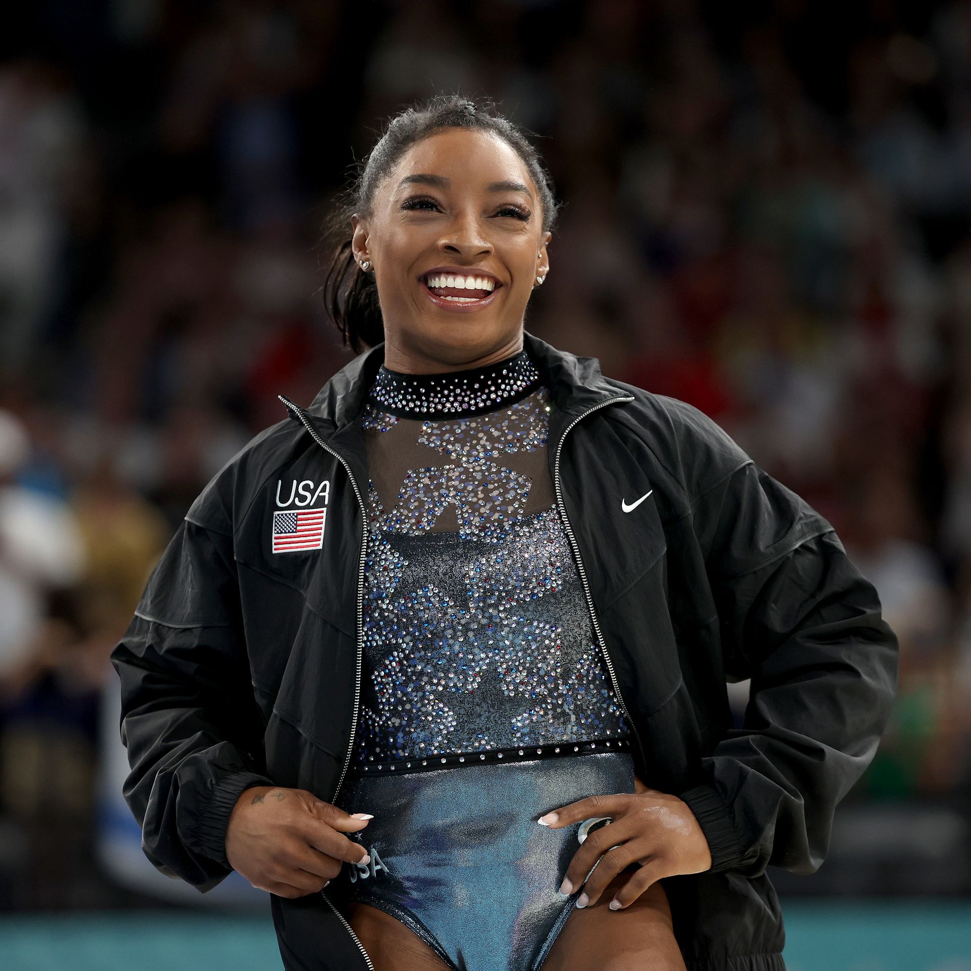 Simone Biles leads Team USA in qualifying, despite calf pain