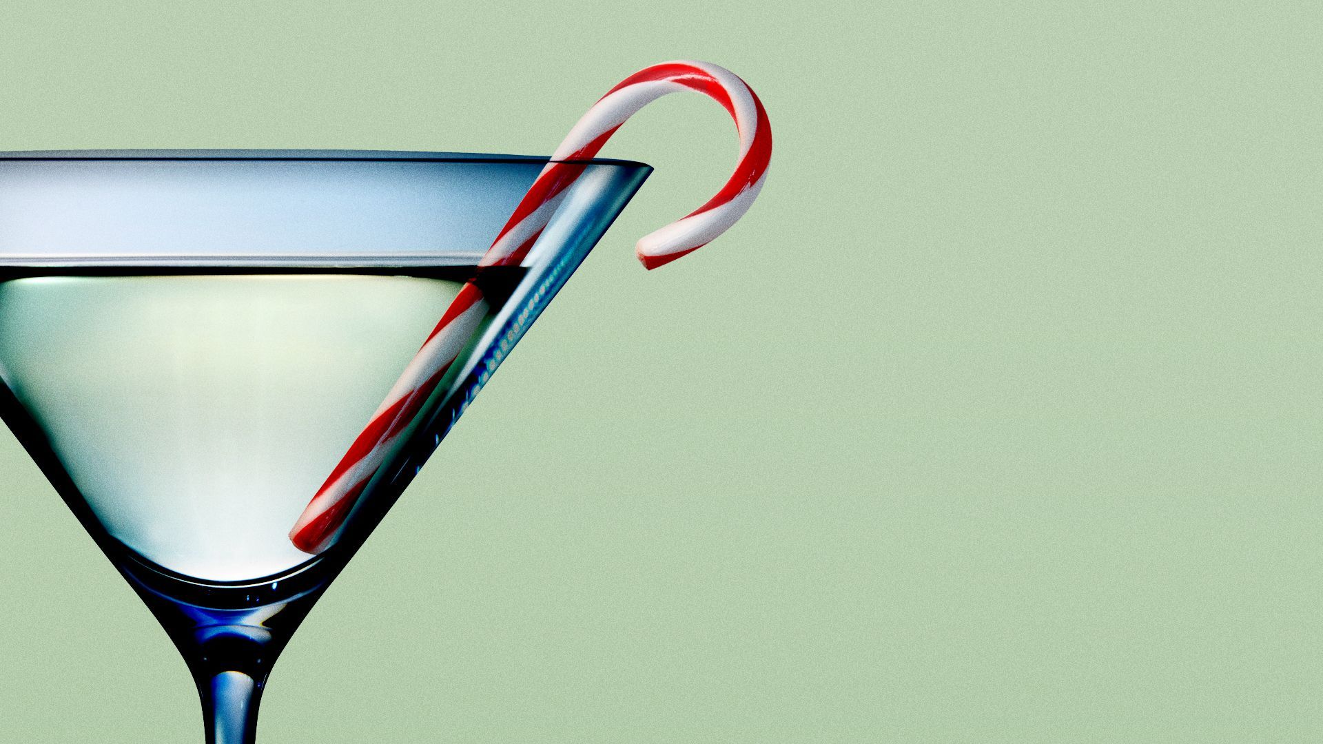 Illustration of a candy cane in a martini glass. 