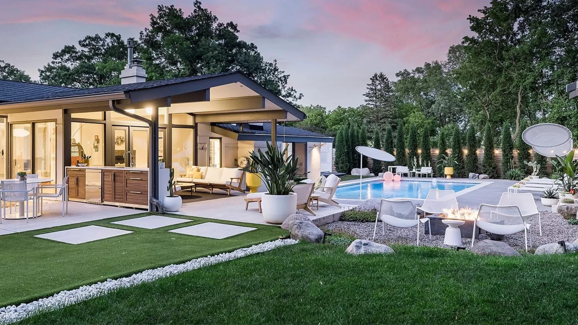 The exterior of a mid-century modern home with a pool.
