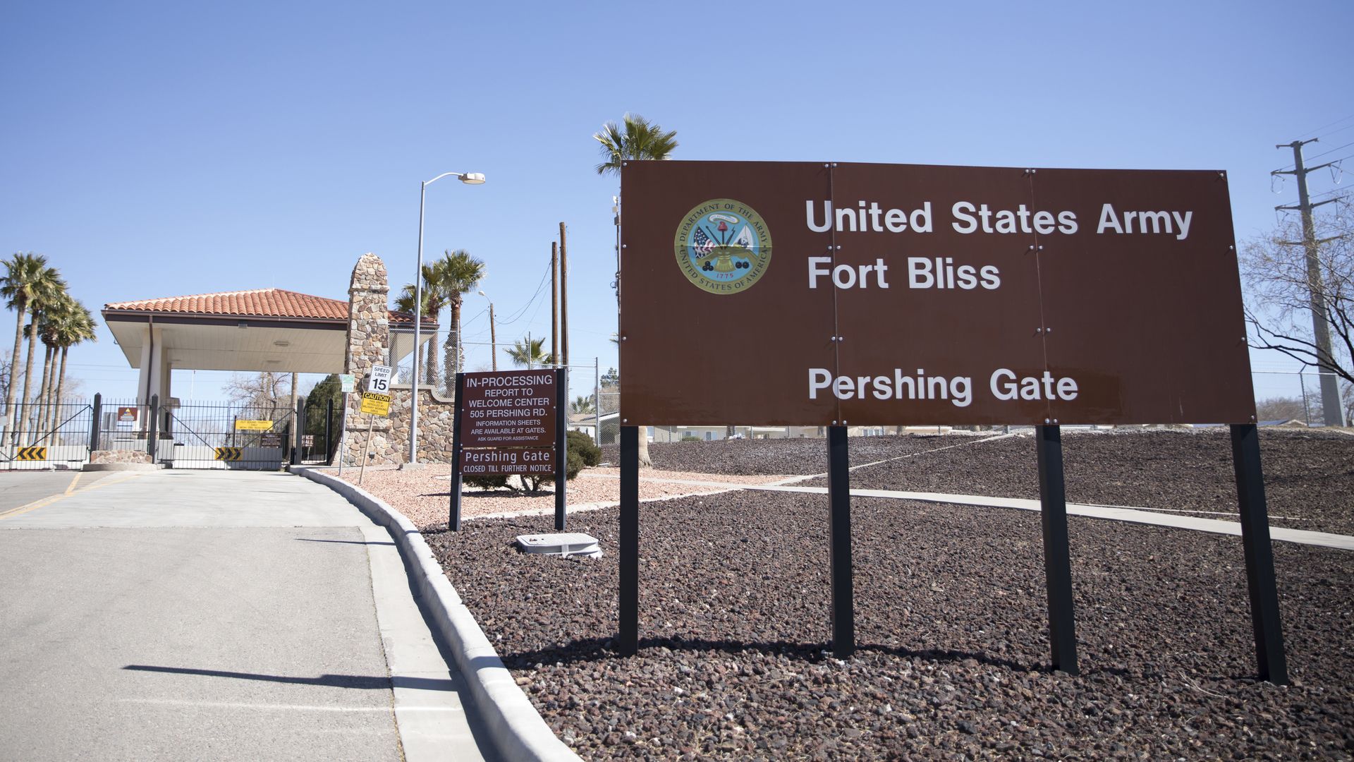 Photo of the entrance to the U.S. Army Fort Bliss base with a stand that states its name and Pershing Gate