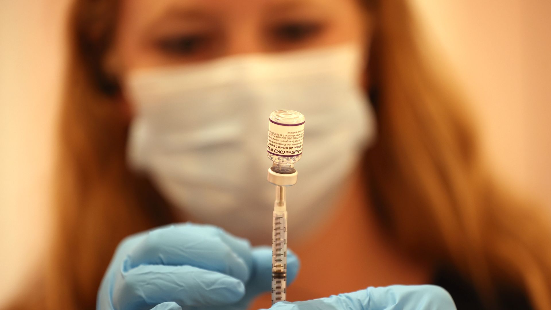 A pharmacist fills a syringe with the Pfizer COVID-19 booster vaccination at a vaccination booster shot clinic on October 01, 2021 in San Rafael, California.