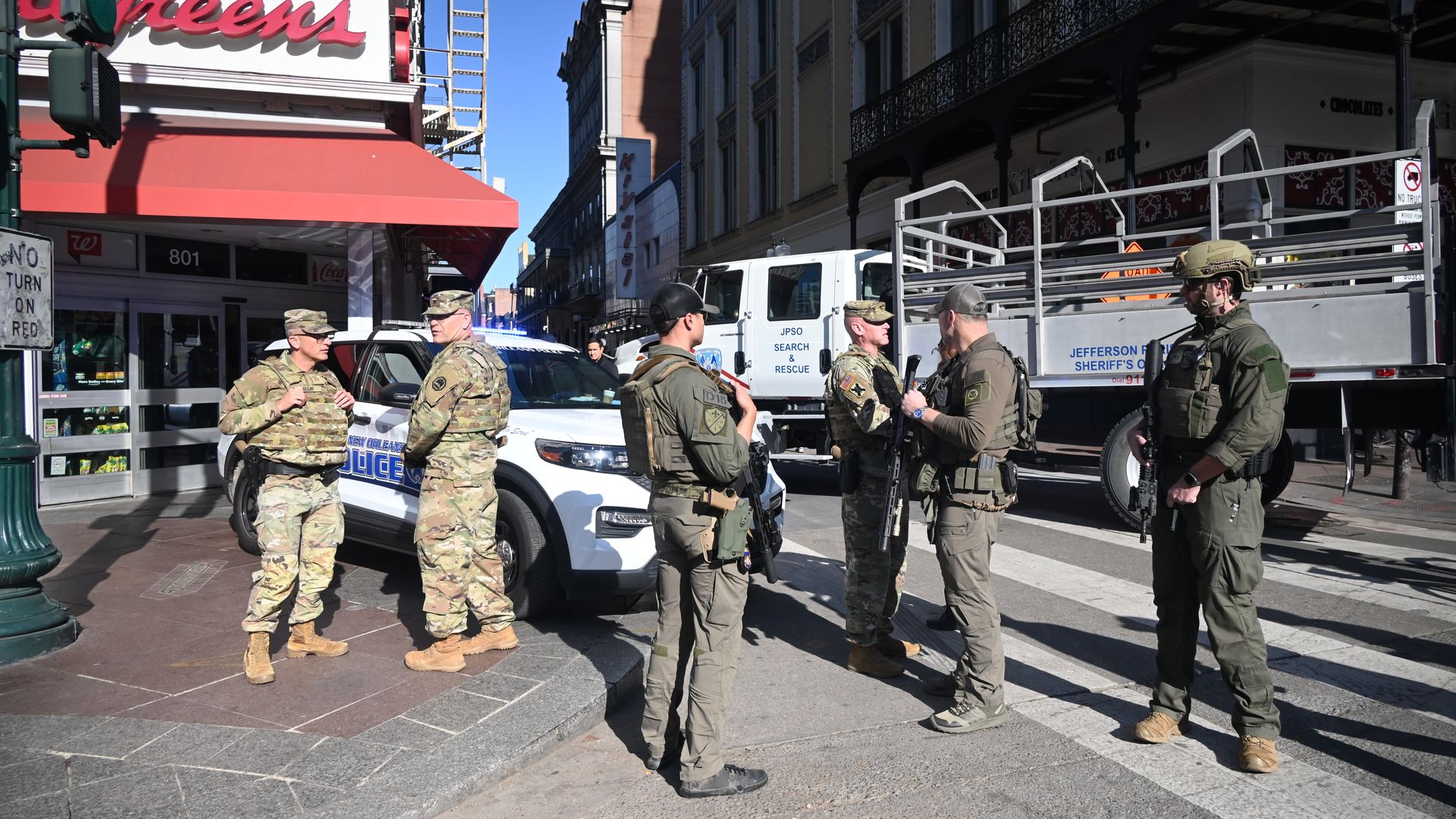 Photo shows law enforcement officers from several agencies near the site of the Bourbon Street attack.