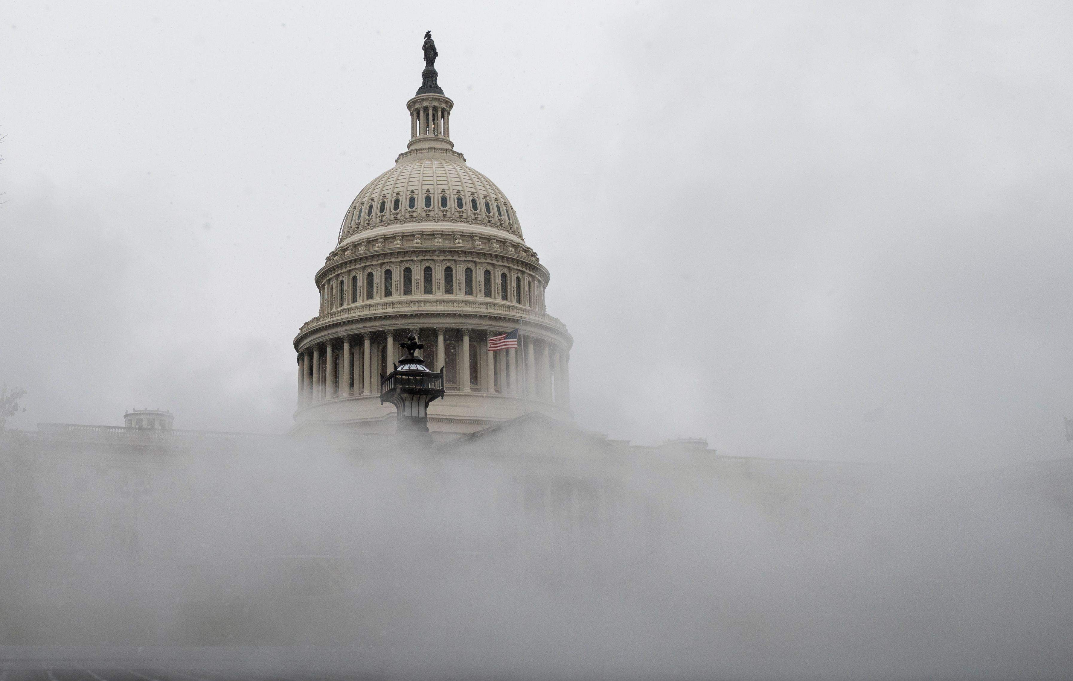 Snow blankets the U.S. Capitol on Dec. 16