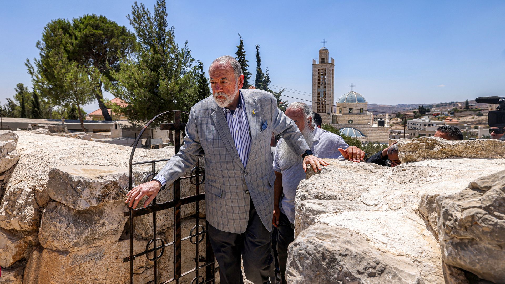 Man walks through gate