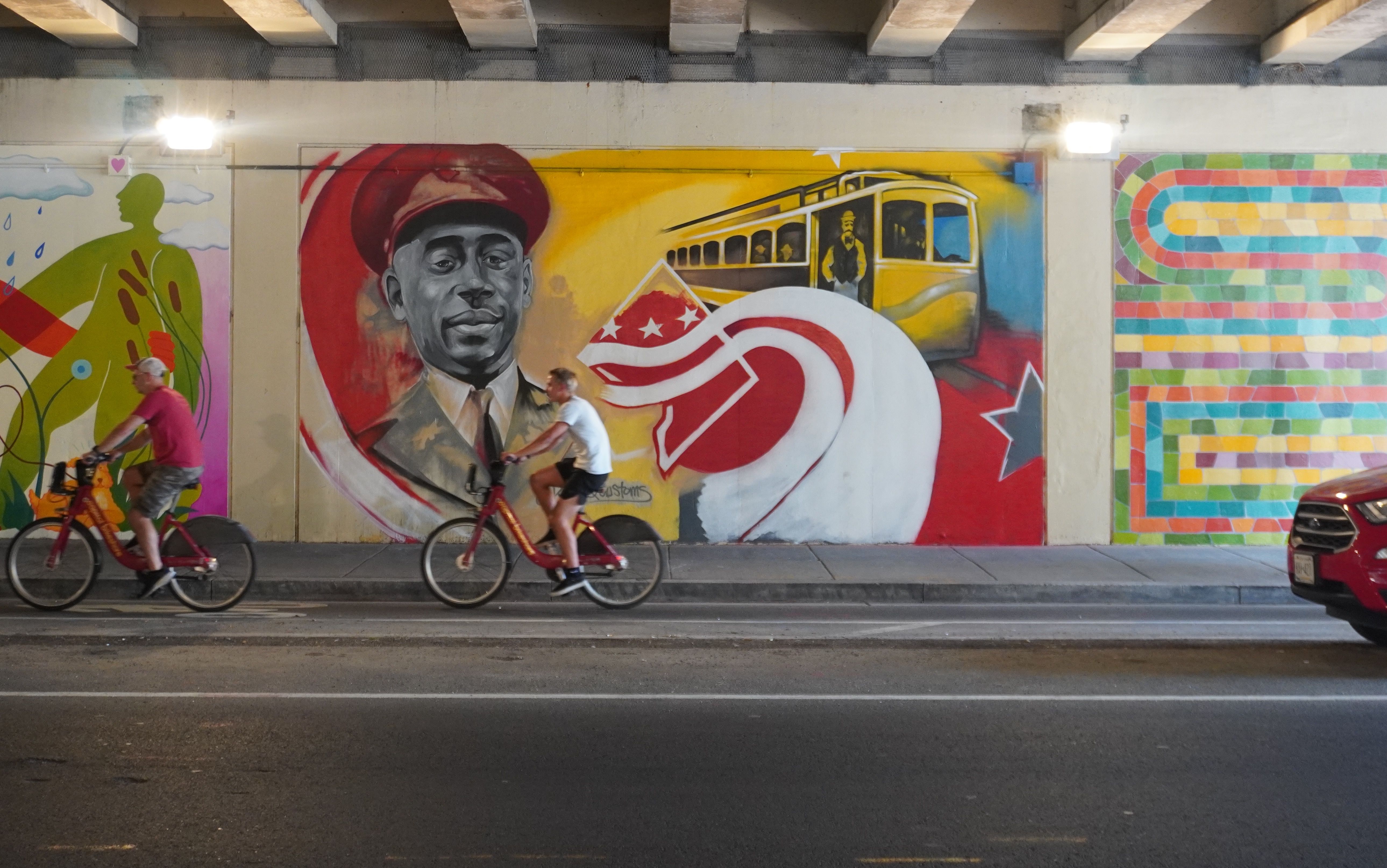 A colorful mural featuring the face of a soldier.