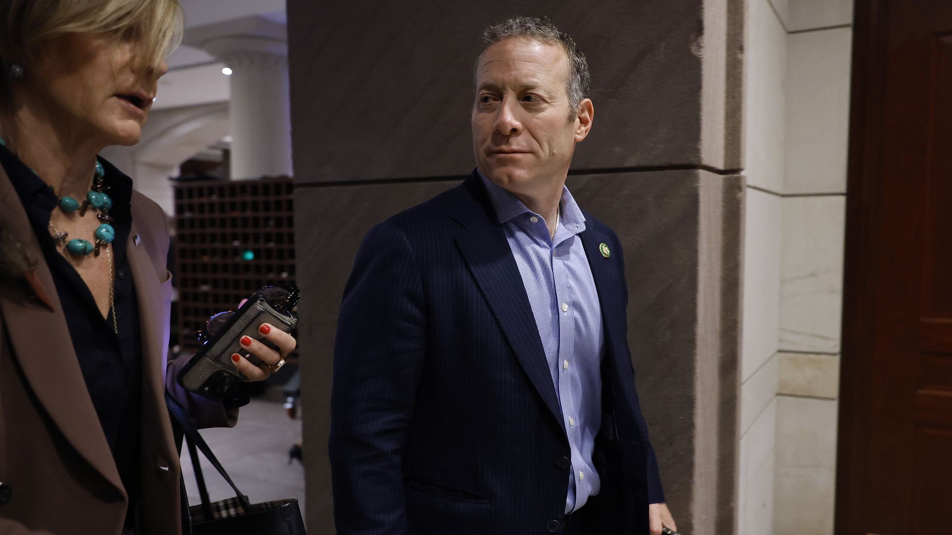 Rep. Josh Gottheimer, wearing a dark blue suit, light blue shirt.