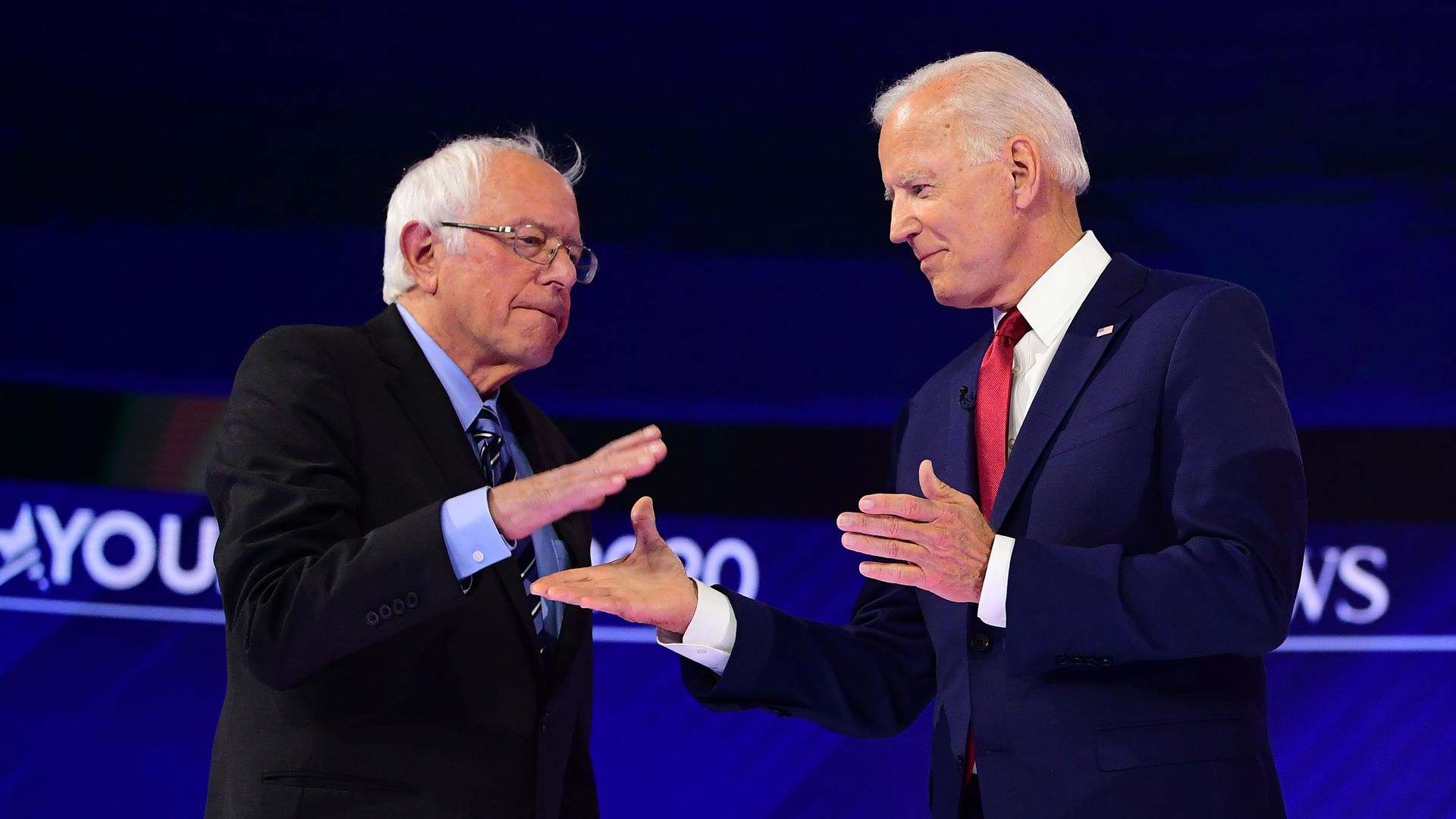 Democratic presidential hopefuls US Senator for Vermont Bernie Sanders (R) greets Former US Vice President Joseph R. Biden Jr. during the third Democratic primary debate