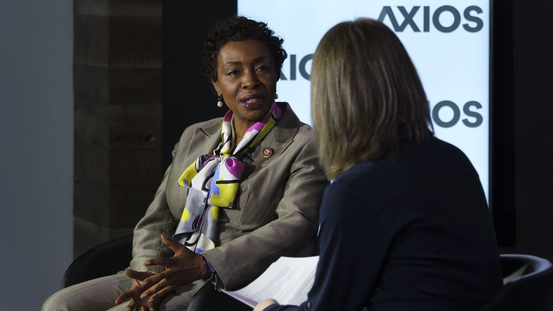 A woman speaks on stage