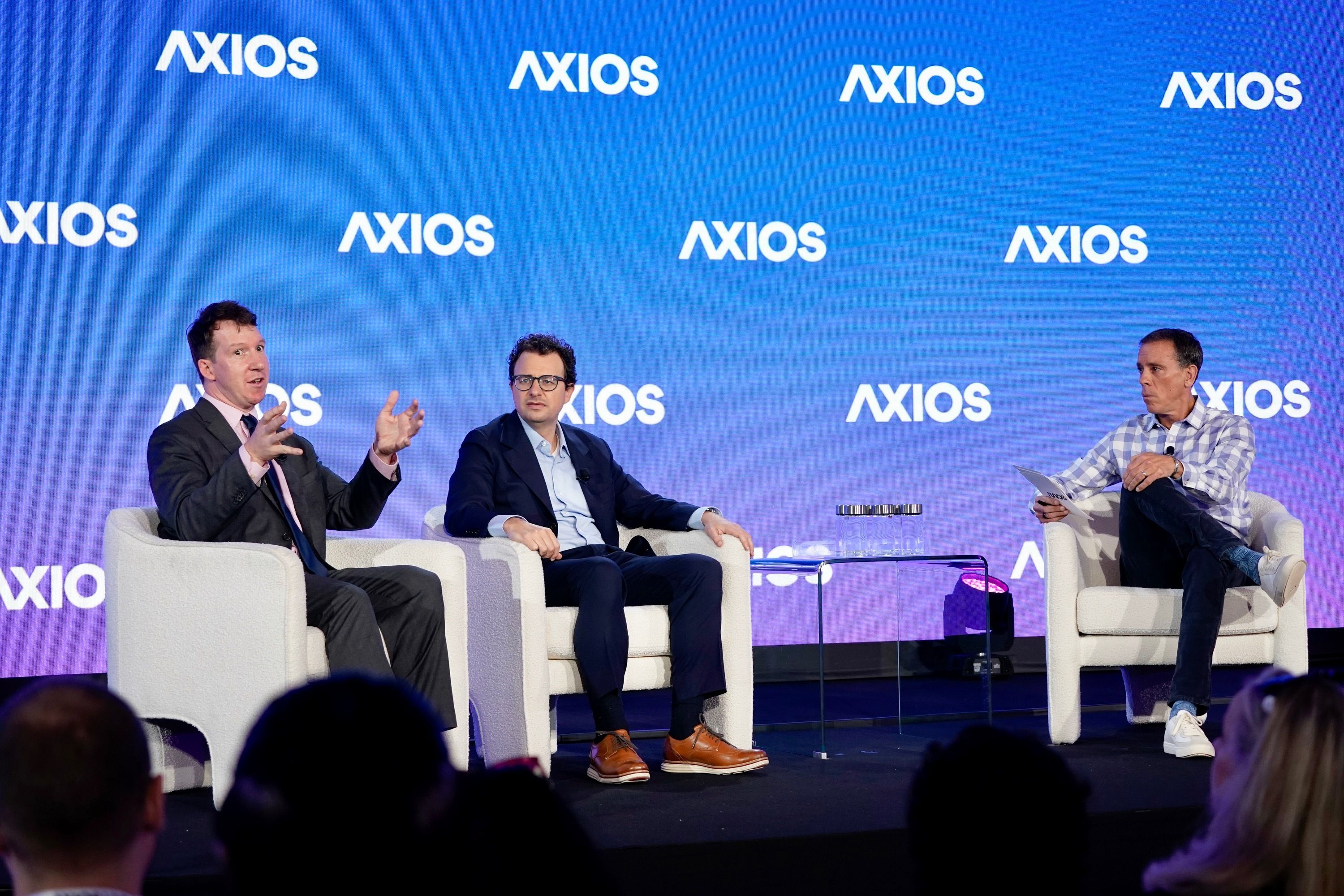 Anthropic co-founder Jack Clark and CEO Dario Amodei talk to Axios CEO Jim VandeHei at the Axios AI+ Summit in DC.
Photo: Bryan Dozier for Axios