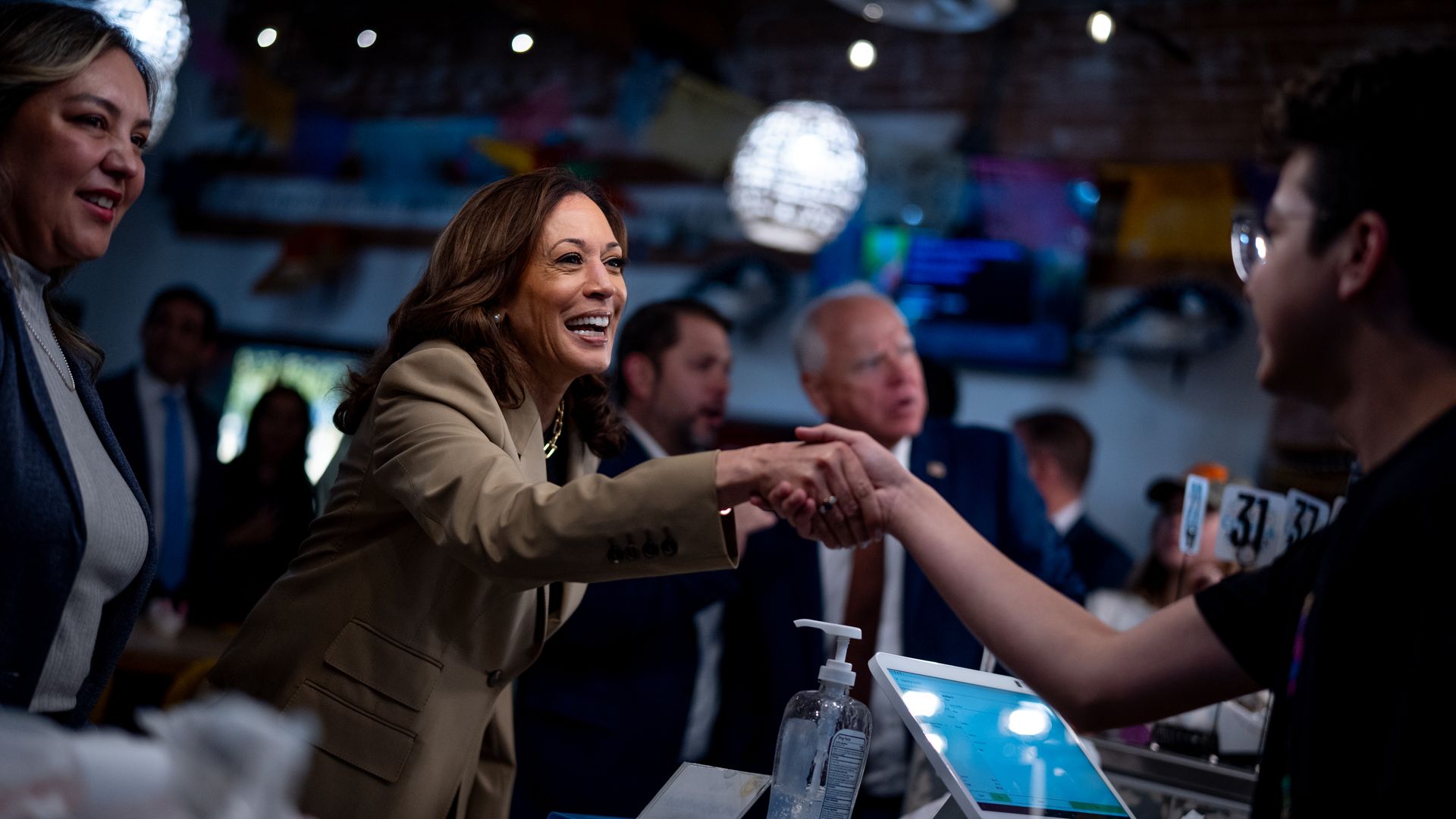 Democratic presidential candidate Kamala Harris, U.S. Rep. Ruben Gallego (D-AZ) and Democratic vice presidential candidate Minnesota Gov. Tim Walz order food at Cocina Adamex restaurant on August 9, 2024 in Phoenix.