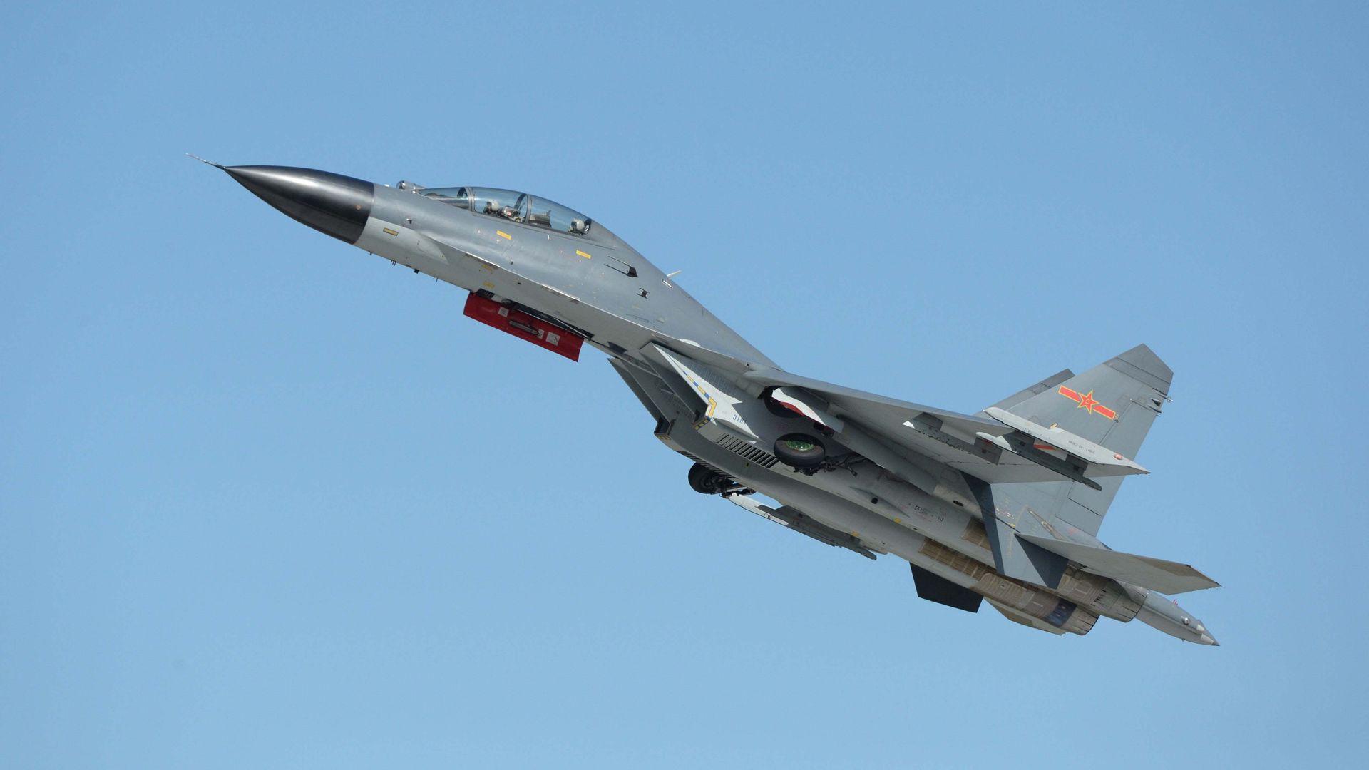 This picture taken on Septernber 12, 2015 shows the J-11B fighter aircraft from the People's Liberation Army (PLA) Air Force performing at the Dafangshen airport in Changchun, China's Jilin province