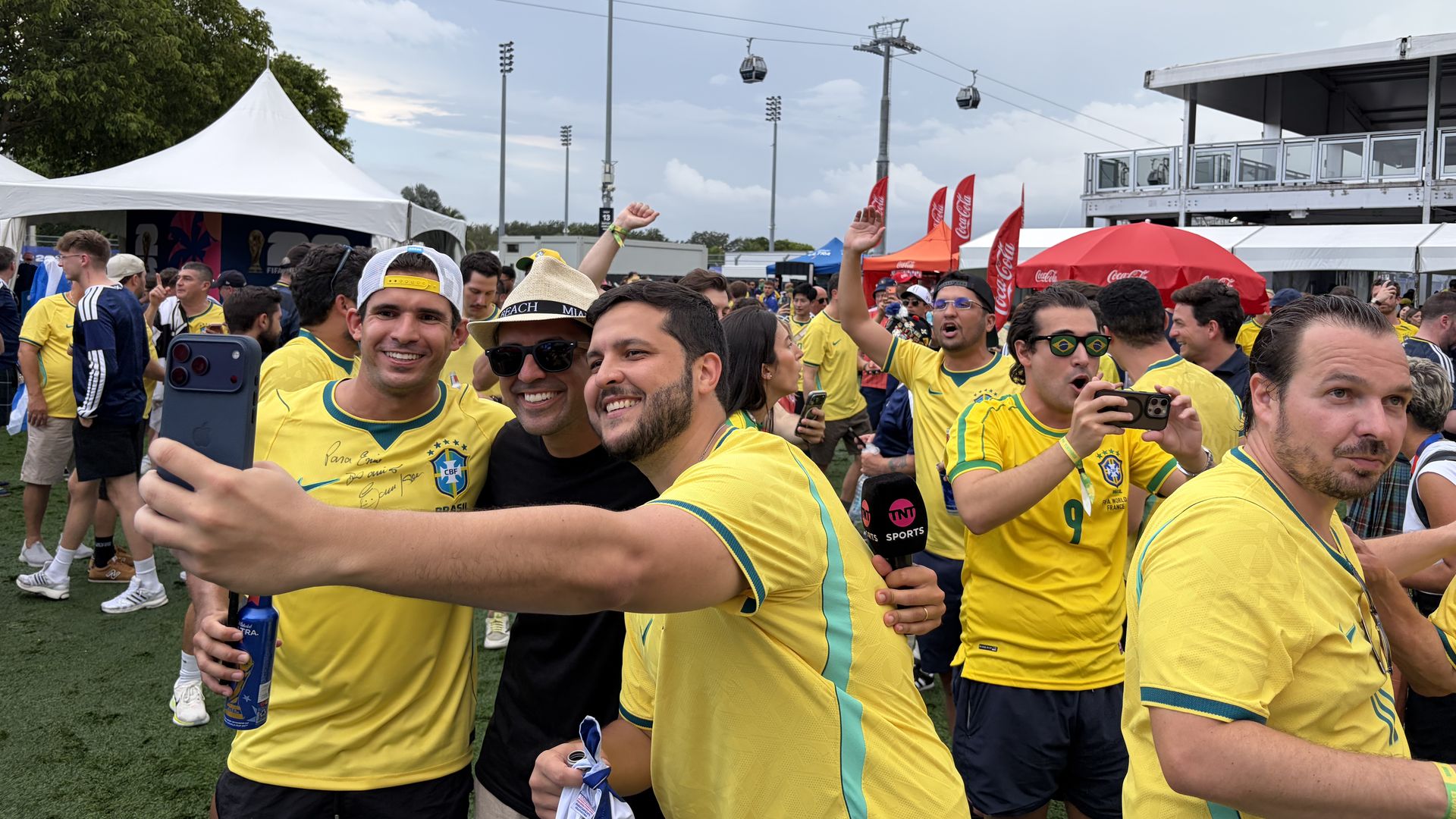 Brazilian fans take a selfie outside Hard Rock Stadium. 
