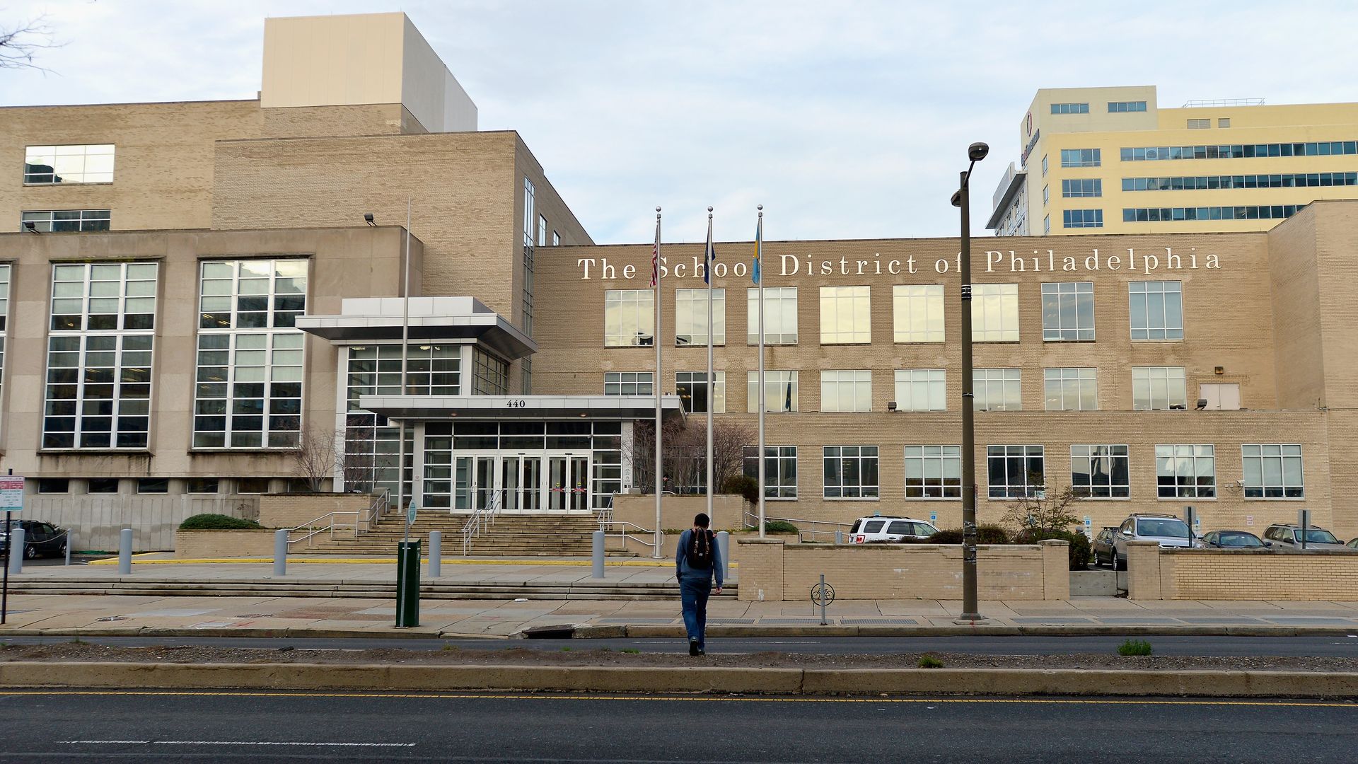 A student walks in front of the School District of Philadelphia's headquarters. 