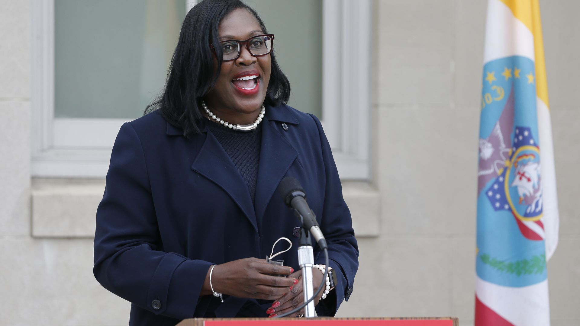 Columbus City Schools superintendent Talisa Dixon speaking in front of a lecturn.