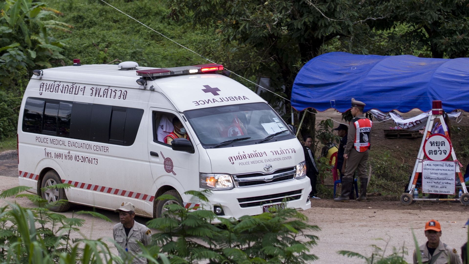 An ambulance sits outside the Tham Luang cave area during rescue operations.